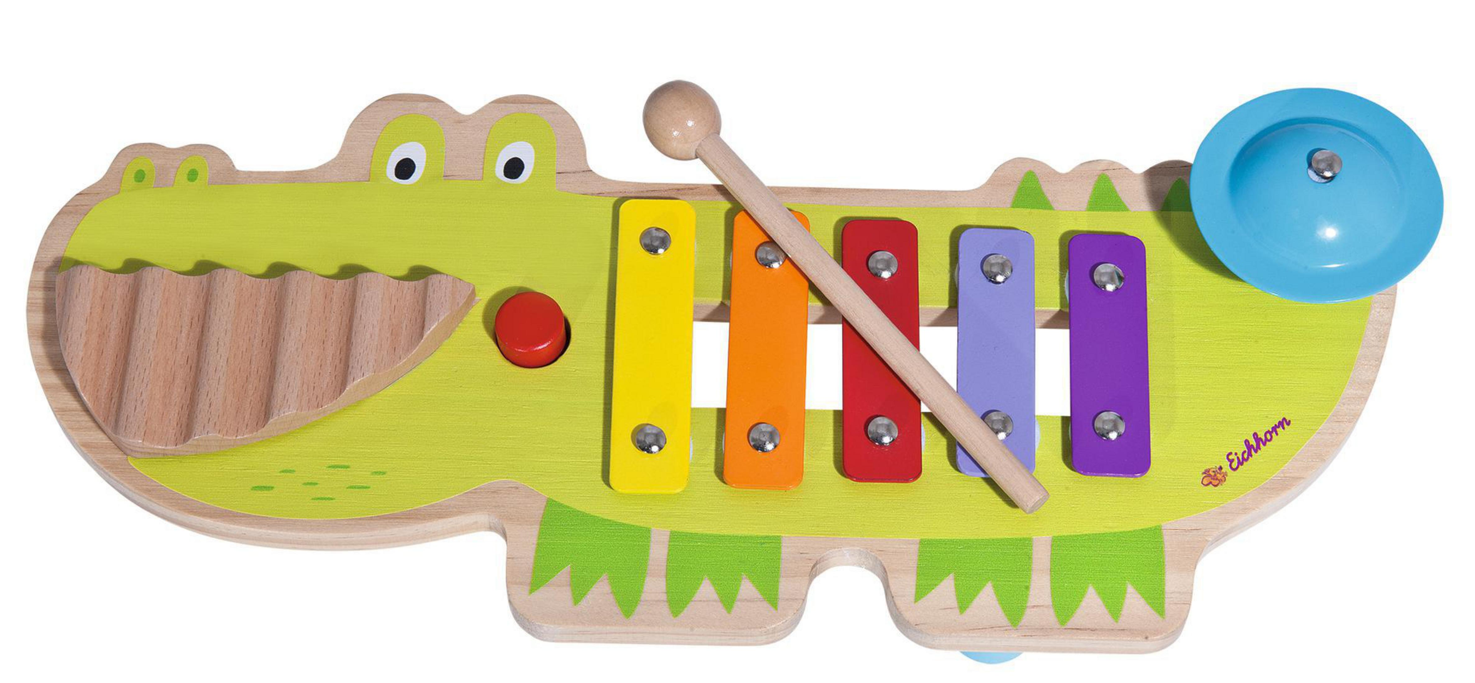 Buntes hölzernes Xylophon in Form eines Alligators, mit einem Schlägel auf den Stäben.