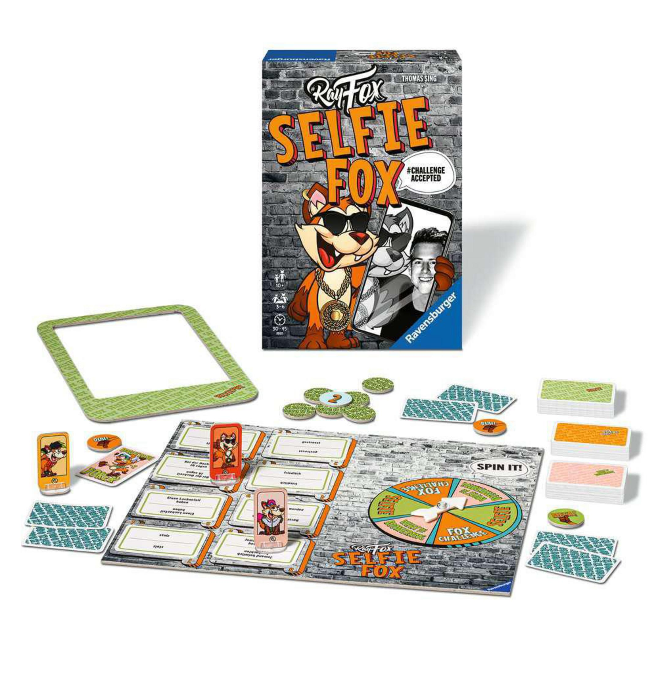 Selfie Fox Brettspiel mit Spielsteinen, Karten und einem grünen Fotorahmen, auf einem Tisch angeordnet.