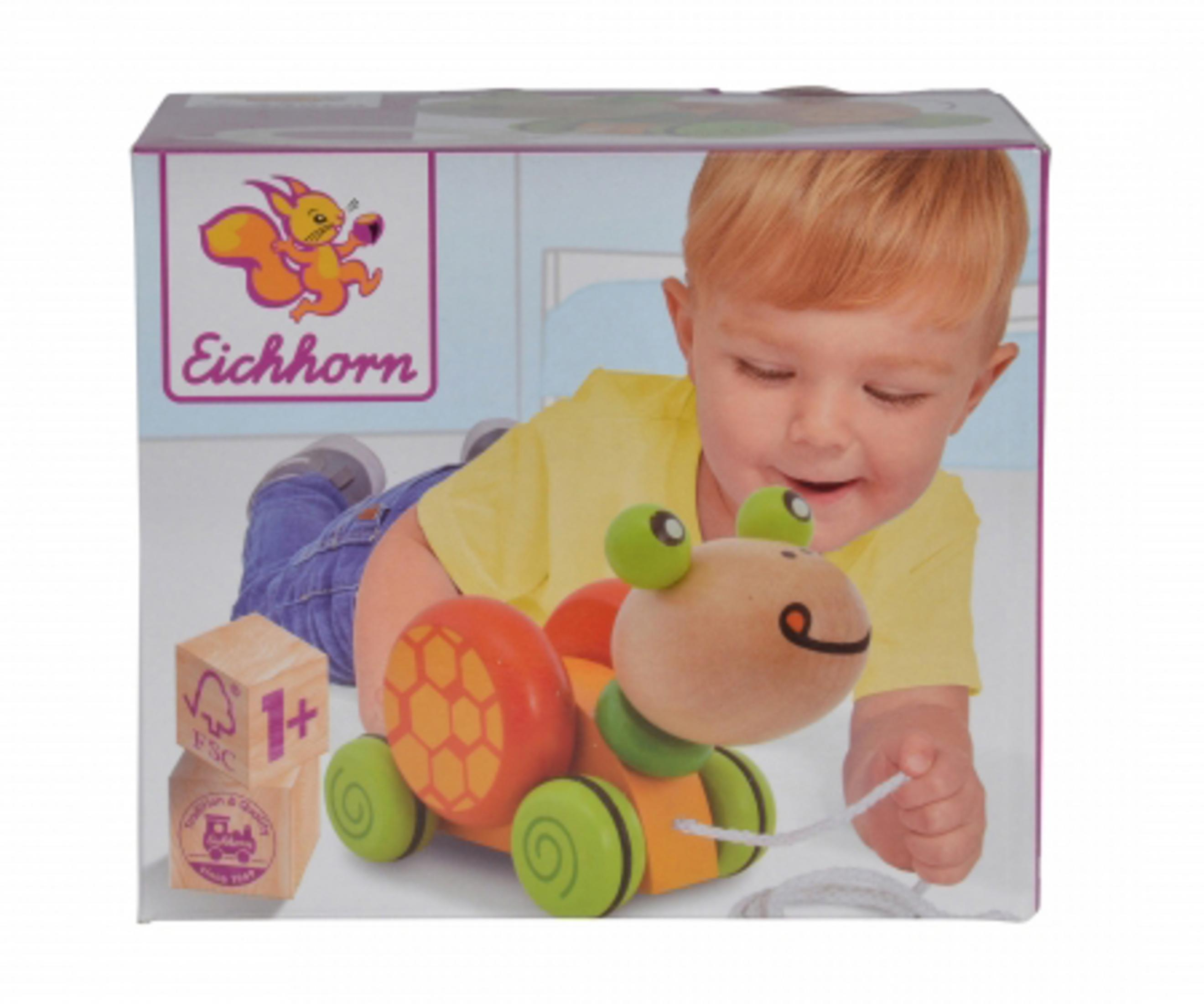 Schachtel eines Holzspielzeugs in Form einer Schnecke, mit Baby.