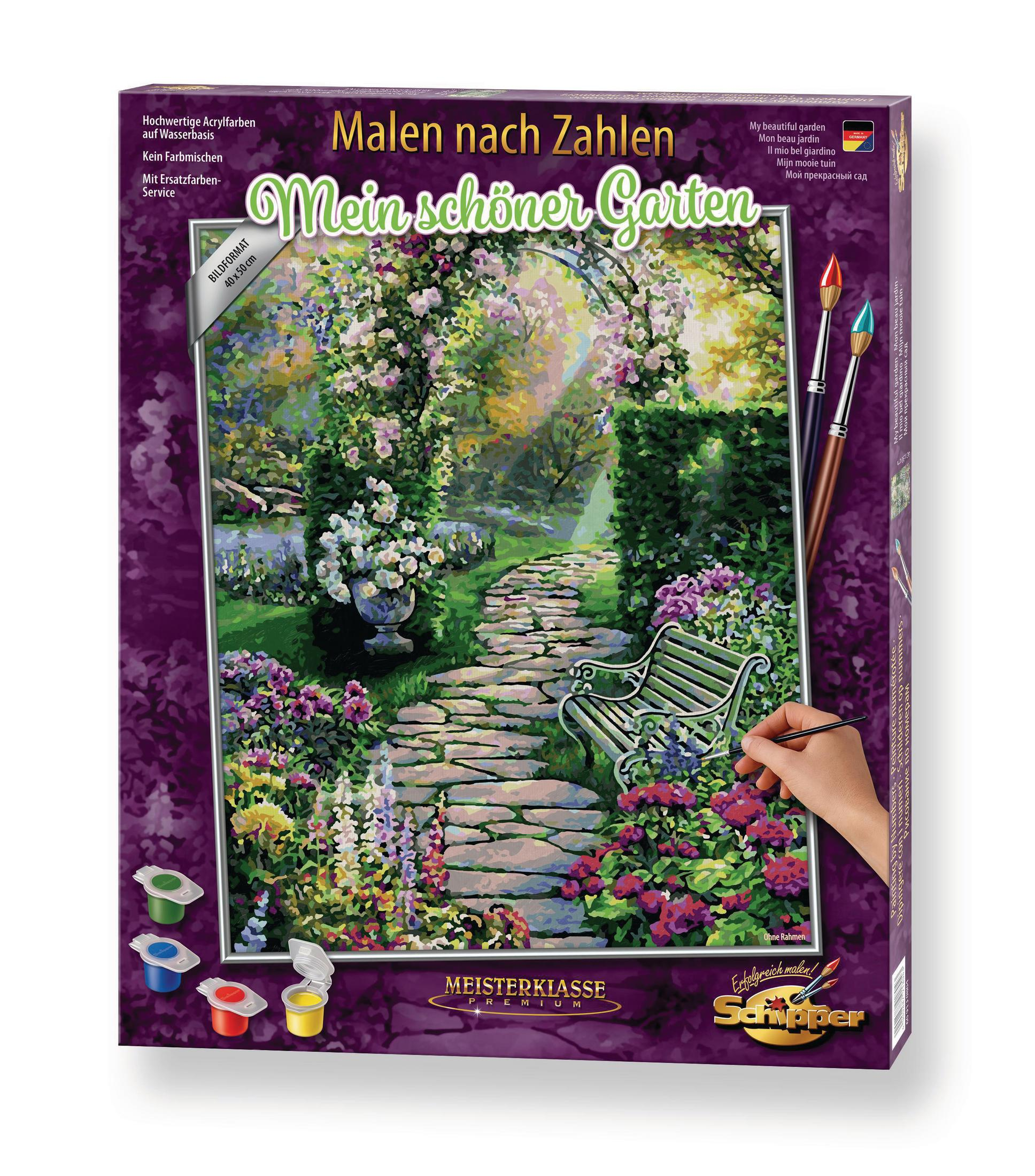 Une boîte de peinture par numéros. L'œuvre d'art montre une scène de jardin avec un chemin et des fleurs.