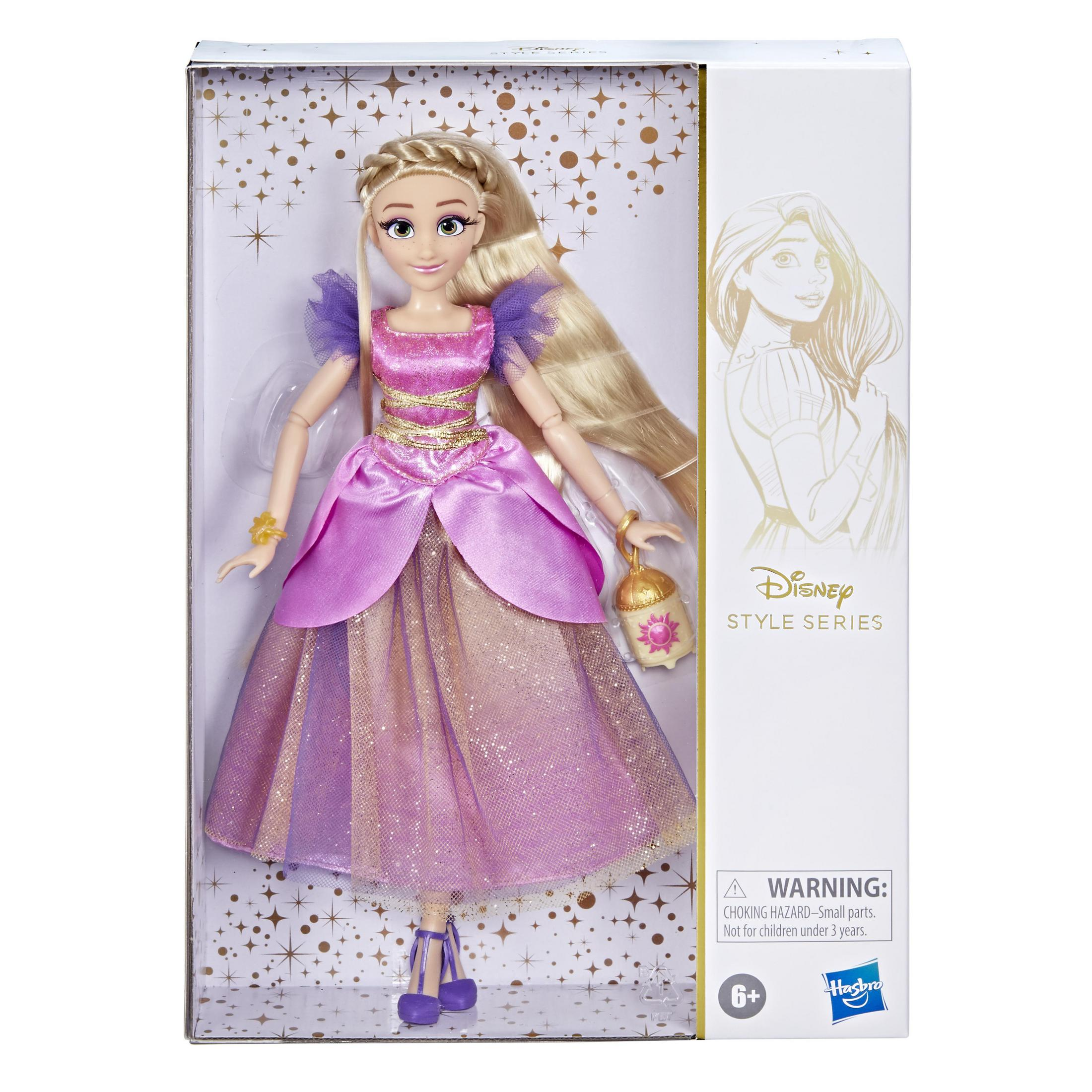 Rapunzel-Puppe in einem rosa-violetten Kleid, mit langen blonden Haaren, in einer Box mit goldenen Akzenten.