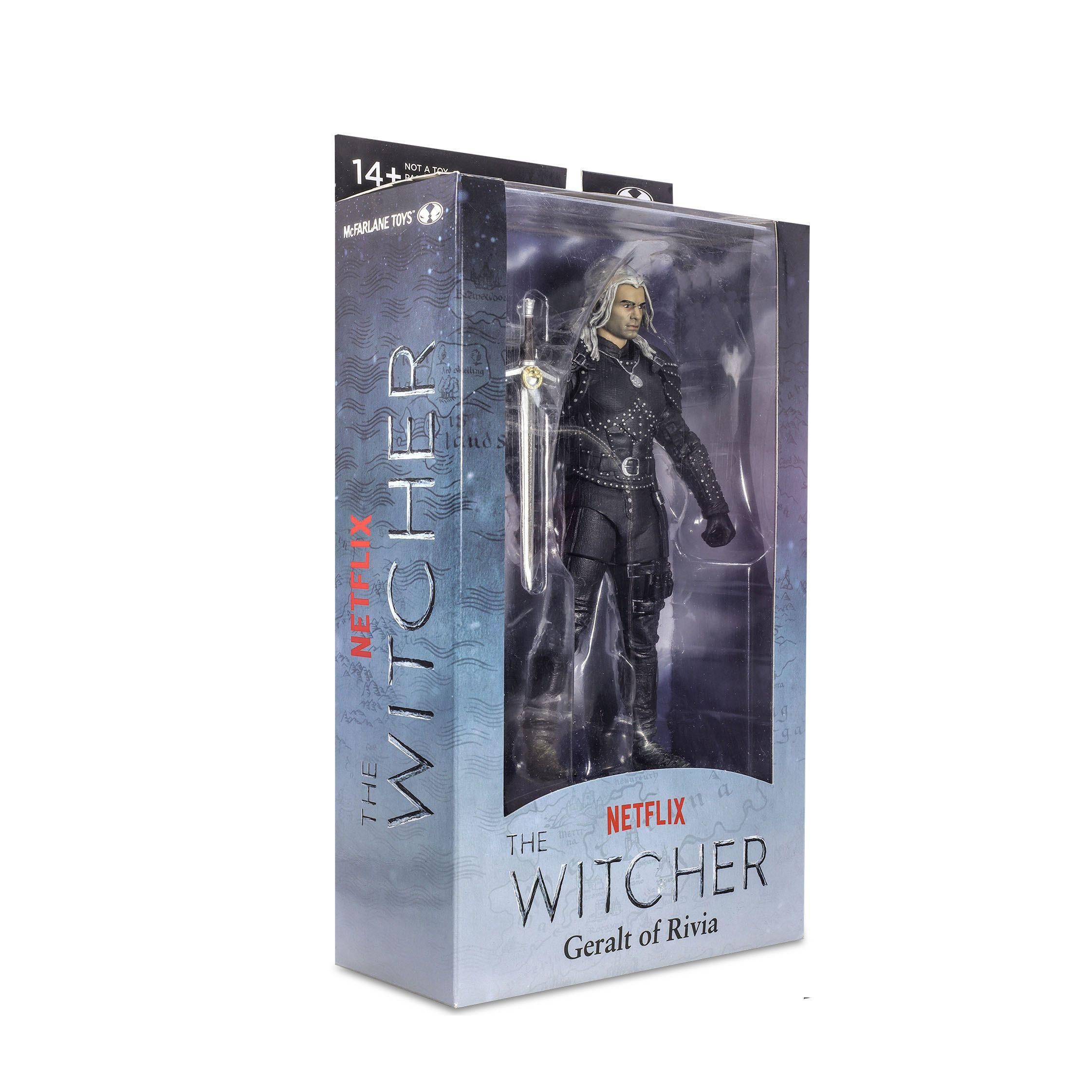 Geralt-Actionfigur in der Box. Er hat weißes Haar und hält ein Schwert. Die Box hat ein Witcher-Logo.