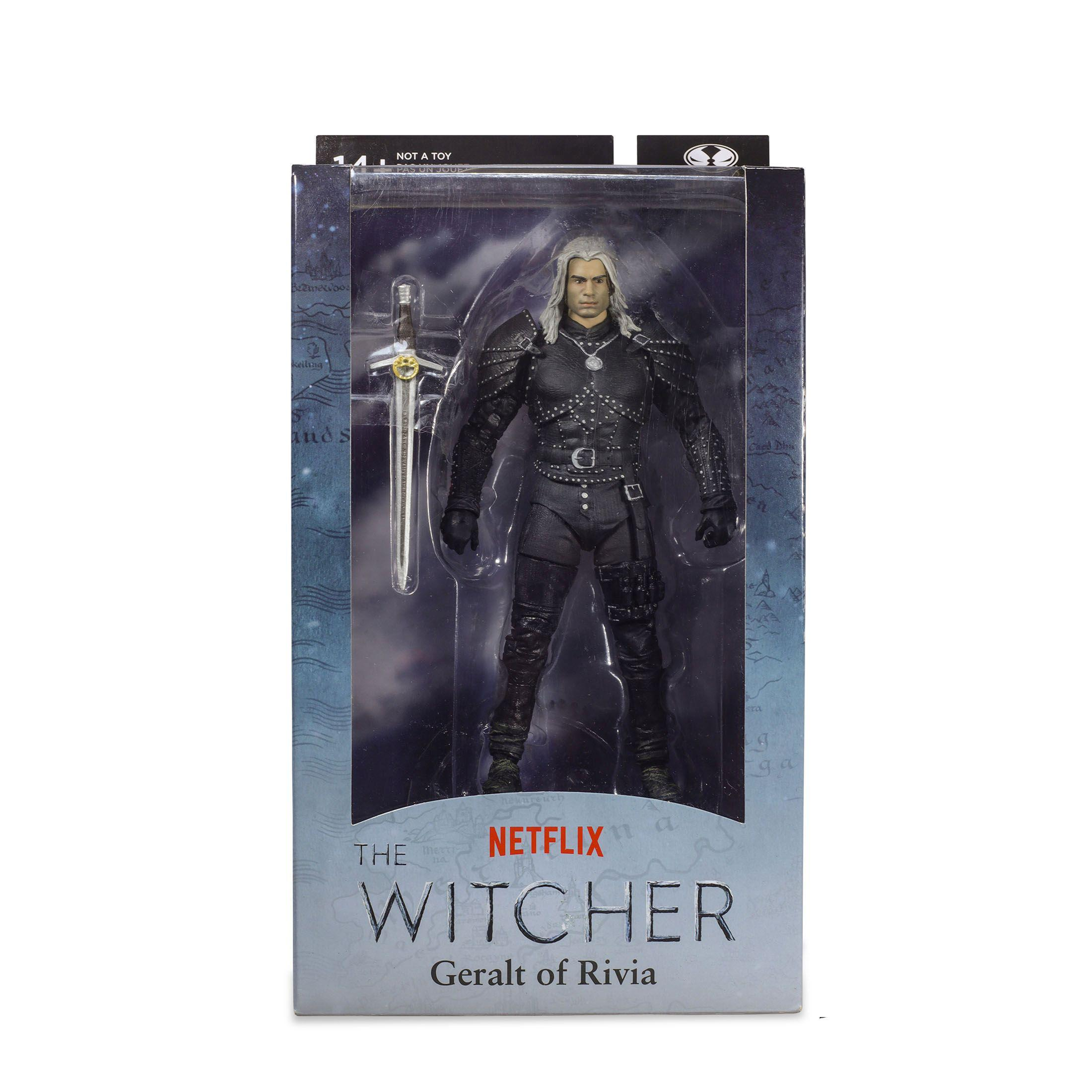 Eine Witcher-Actionfigur in einer Box. Zeigt Geralt von Riva mit Schwert und schwarzem Outfit.