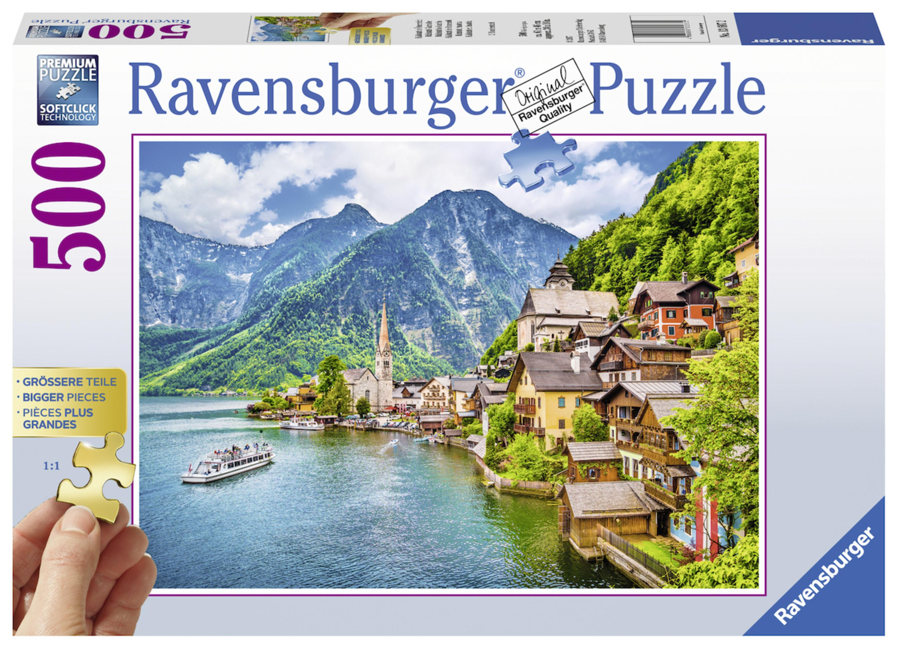 Eine Ravensburger Puzzlebox mit einer malerischen Aussicht auf ein Dorf an einem See mit Bergen.
