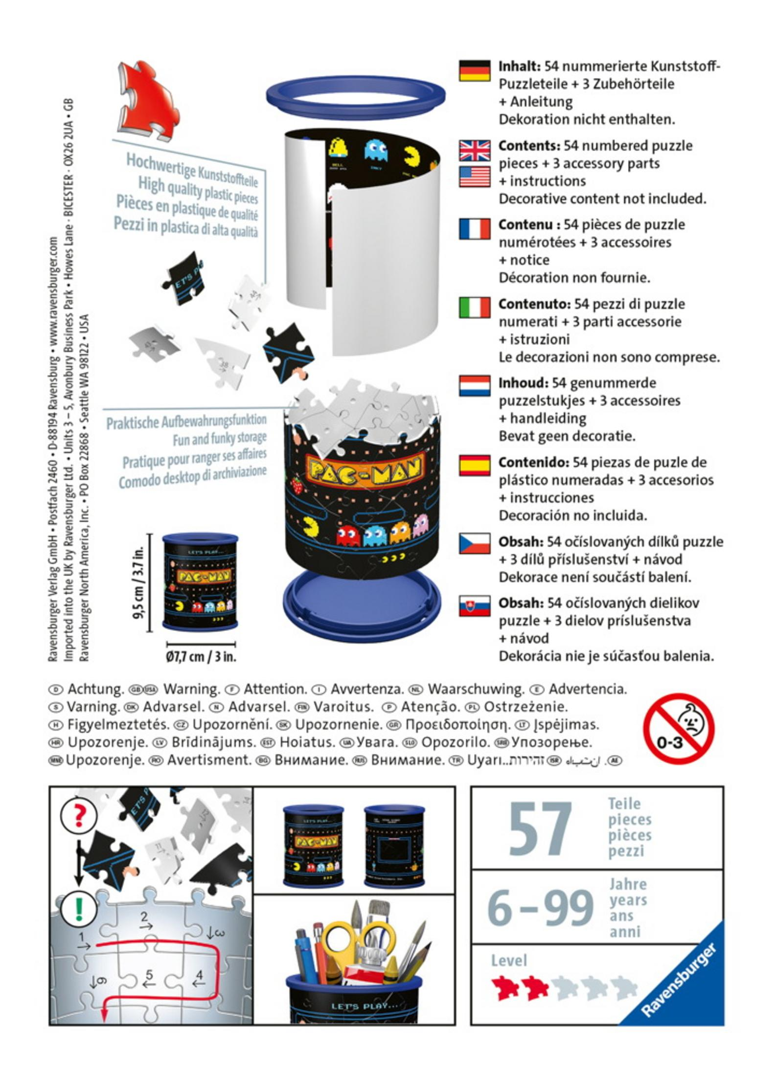 Pudełko z puzzlami o tematyce Pac-Man z elementami i akcesoriami.