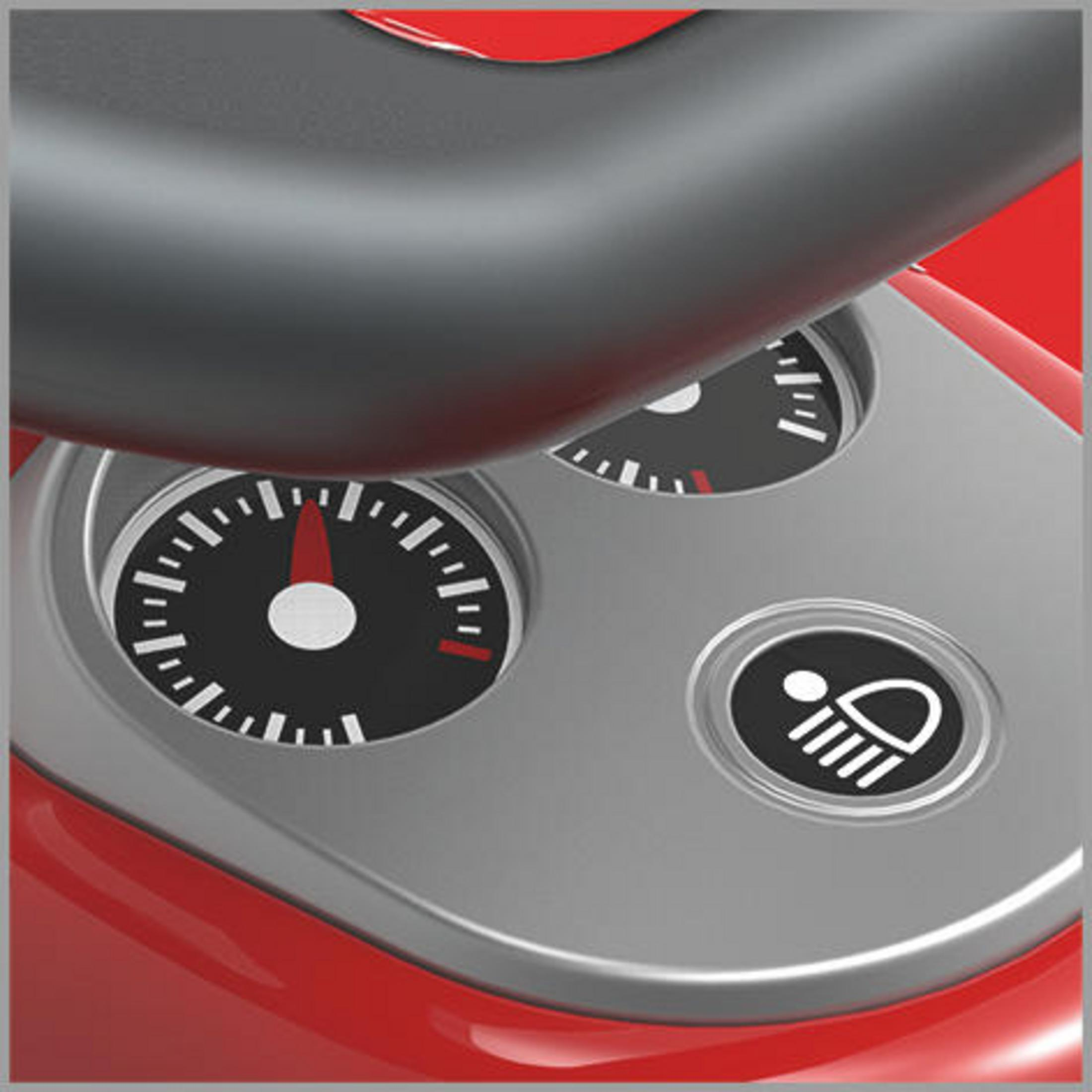 Armaturenbrett mit Zifferblättern und einem Scheinwerfer-Symbol auf einem roten Spielzeugauto.