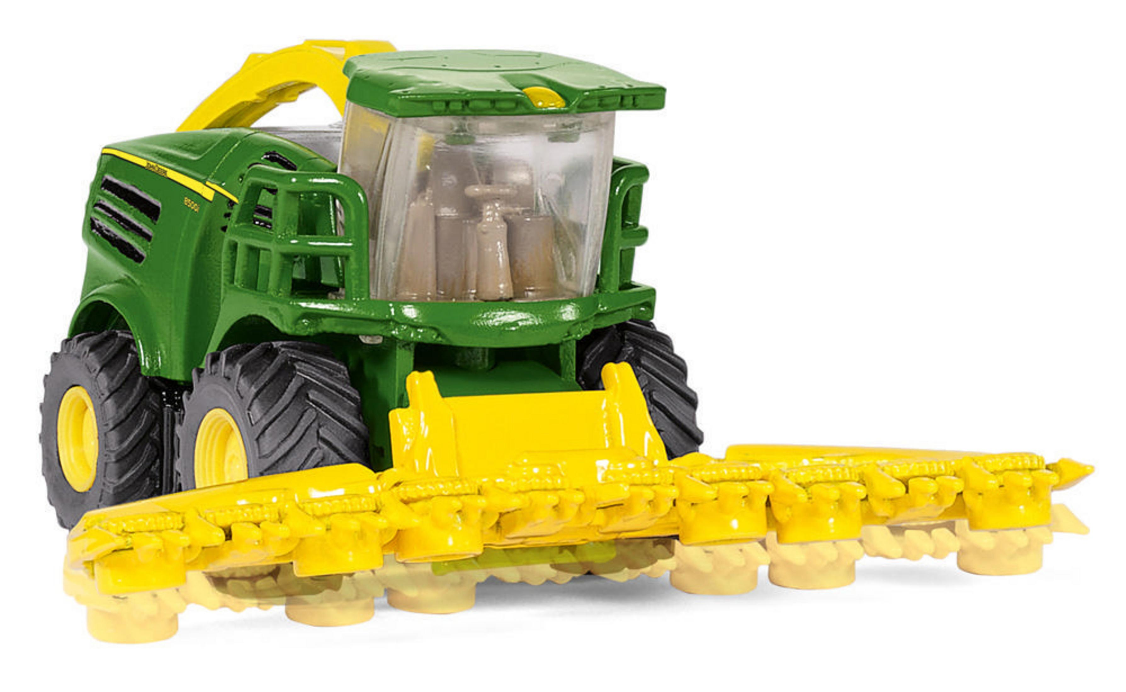 Grüner und gelber Spielzeugmähdrescher. Verfügt über einen großen Schneidkopf und detailliertes Design.
