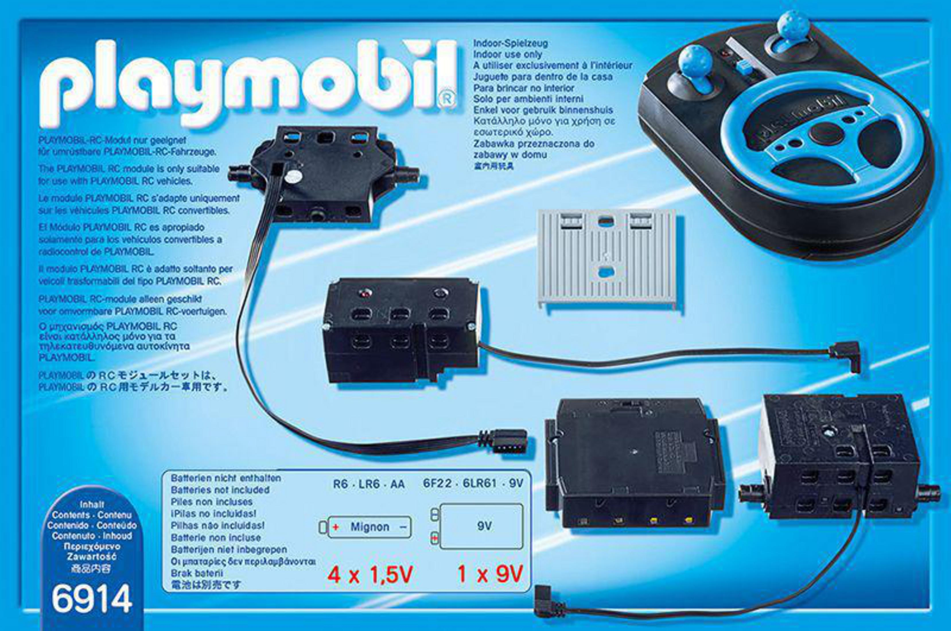 Playmobil RC-Set: schwarze Module, Controller, Batterien. Text in mehreren Sprachen.