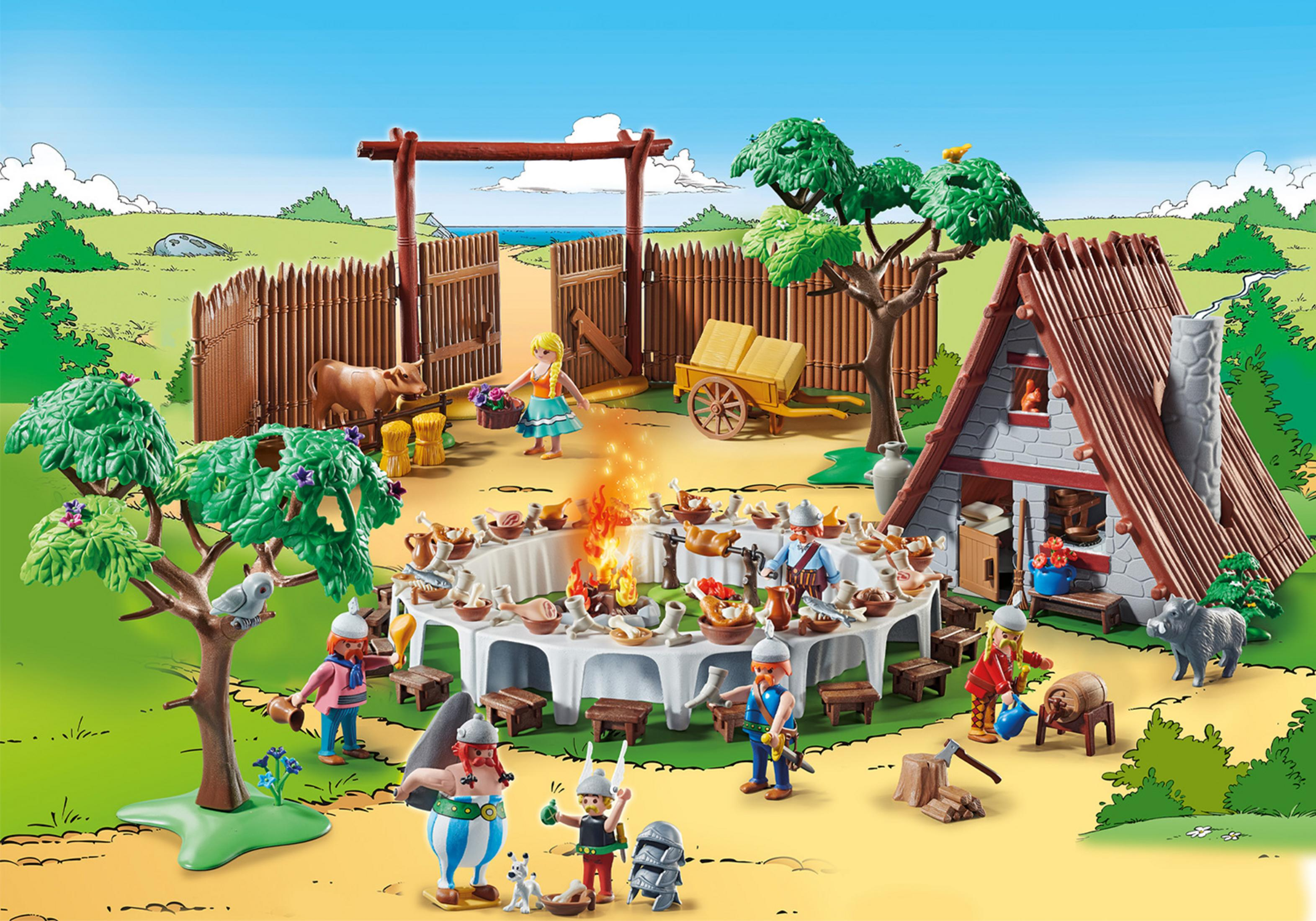 Ein Playmobil-Set mit einer Dorfszene. Figuren versammeln sich um einen Tisch mit Essen, Feuer in der Mitte.
