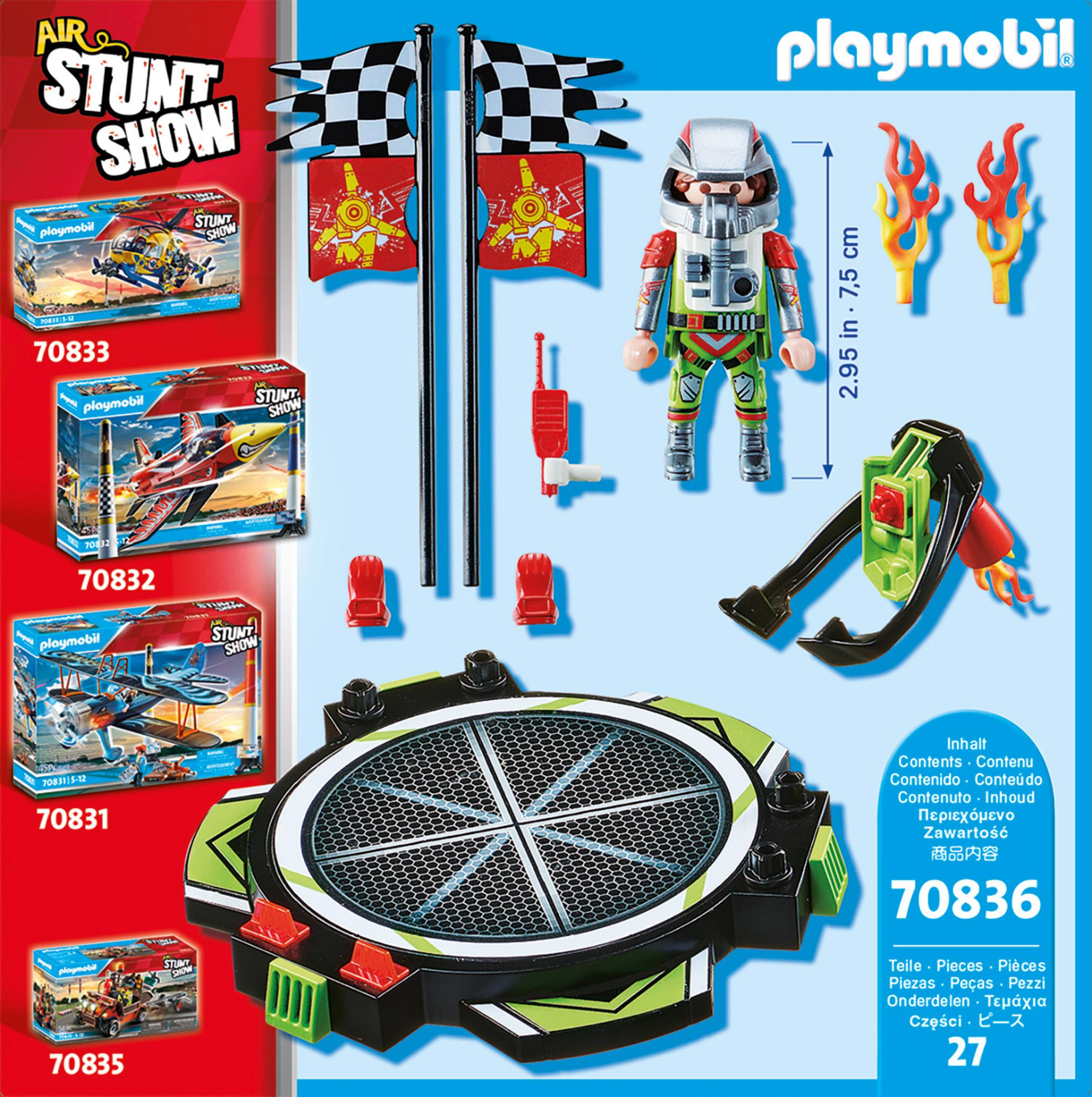 Playmobil Stunt Show Set mit Figuren, Fahnen und einer kreisförmigen Bühne. Enthält Kartons mit Sets.