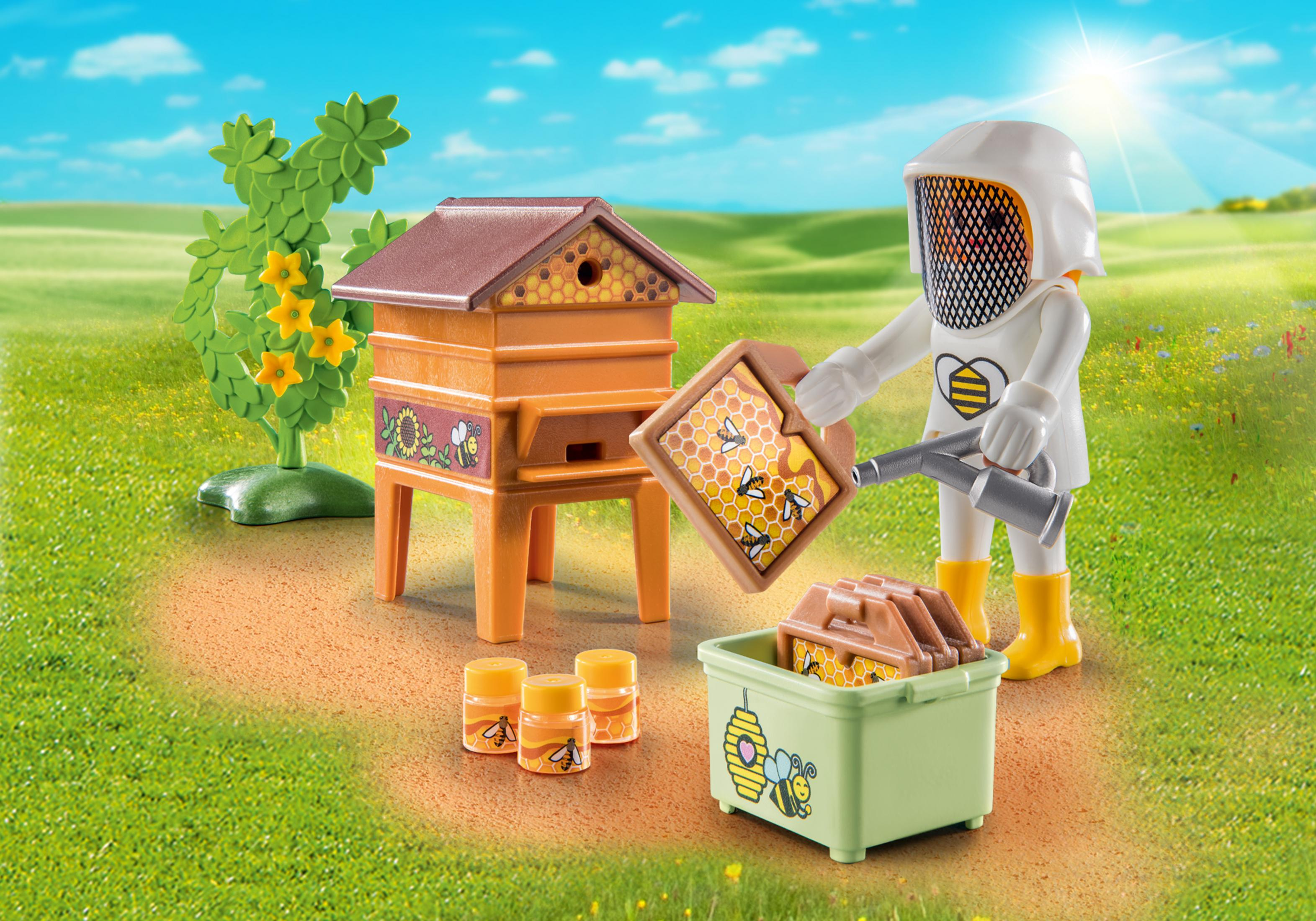 Playmobil-Set: ein Imker und ein Bienenstock mit Bienen, umgeben von Honigtöpfen.