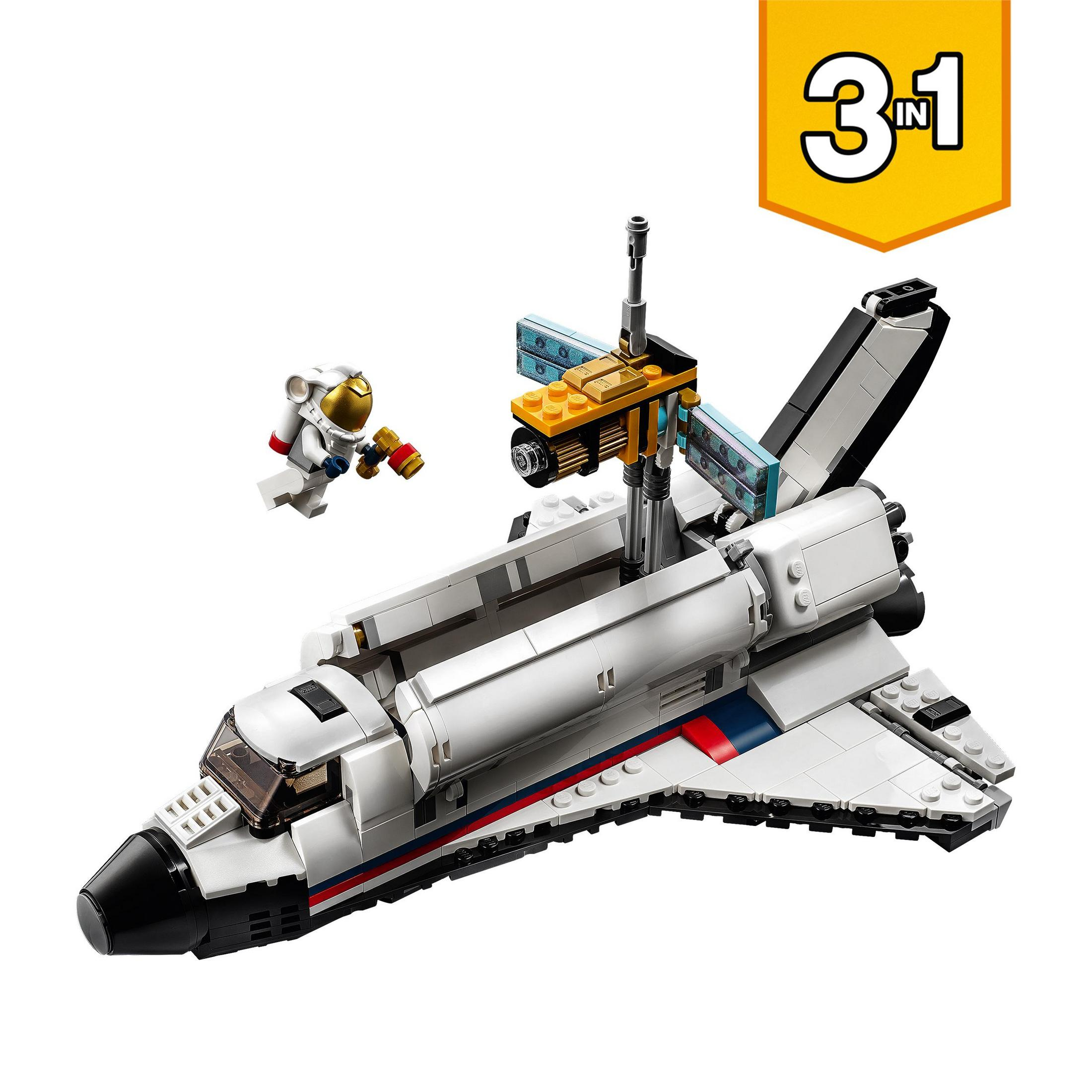 Ein weißes LEGO-Weltraumfähre-Spielzeug mit einer kleinen Astronautenfigur daneben.