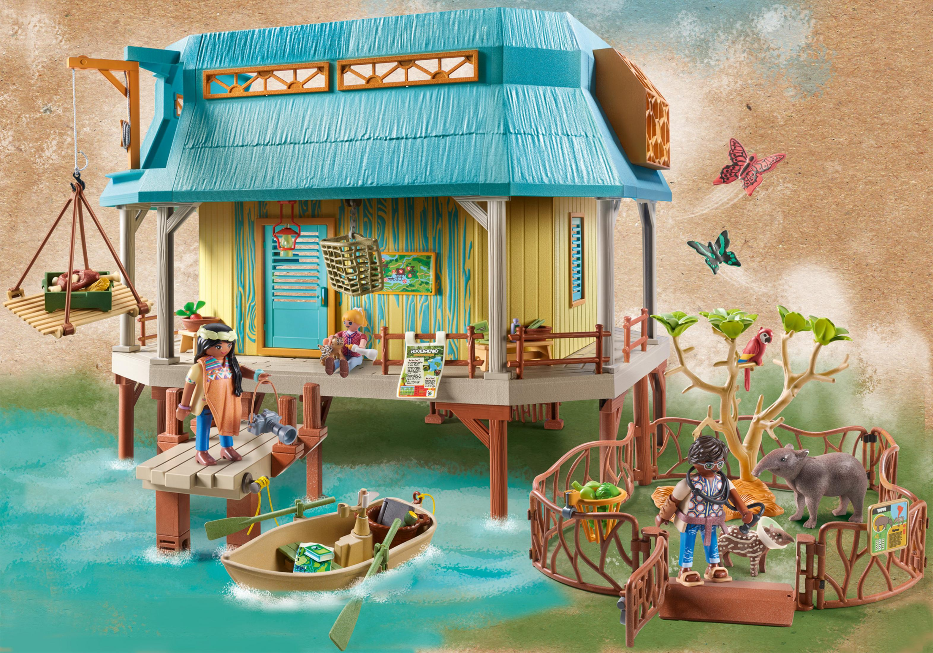 Eine Playmobil-Dschungelszene mit Haus, Boot, Figuren und Tieren, darunter ein Tapir.