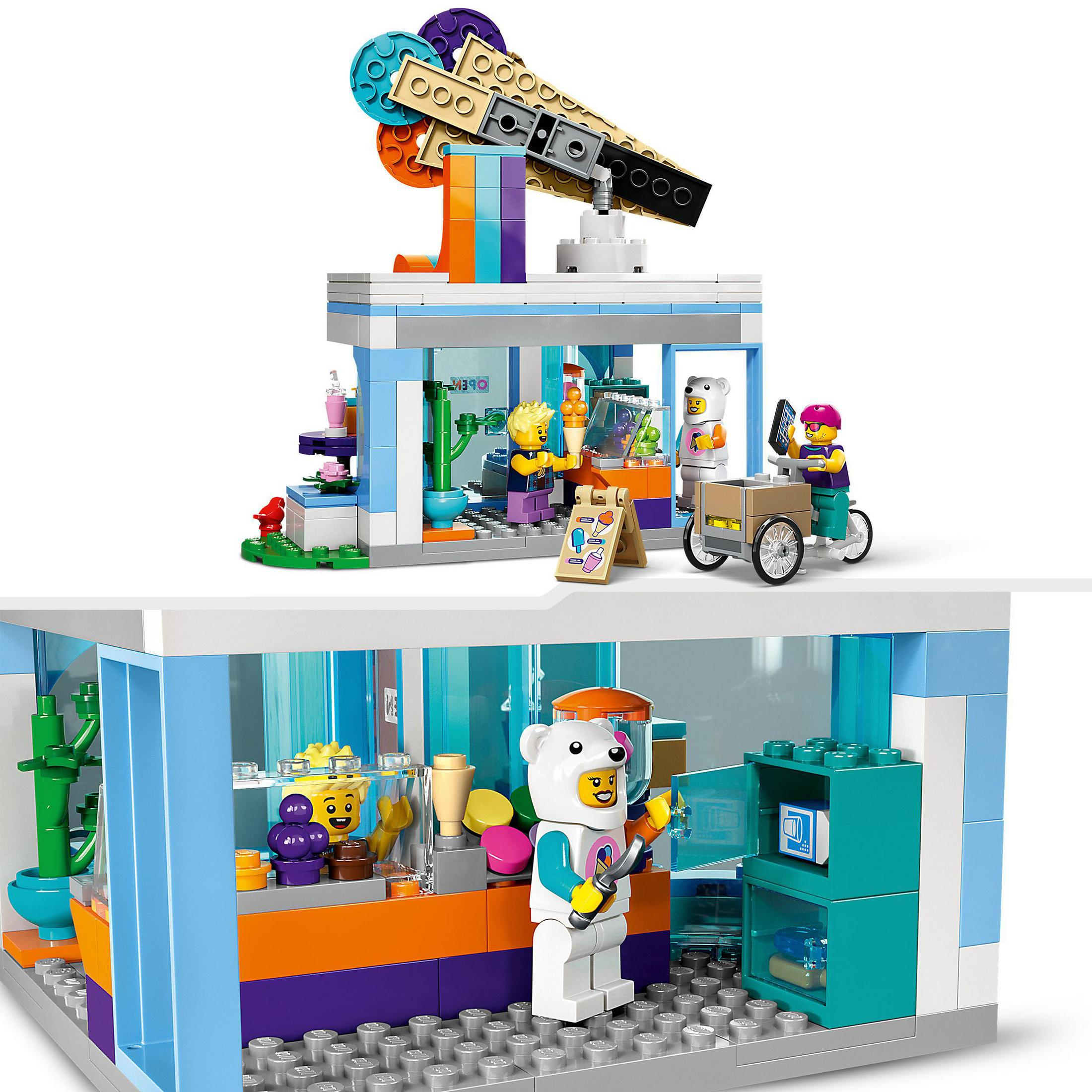 Set LEGO Friends con un bar, minifigure e accessori, interni, design colorato.