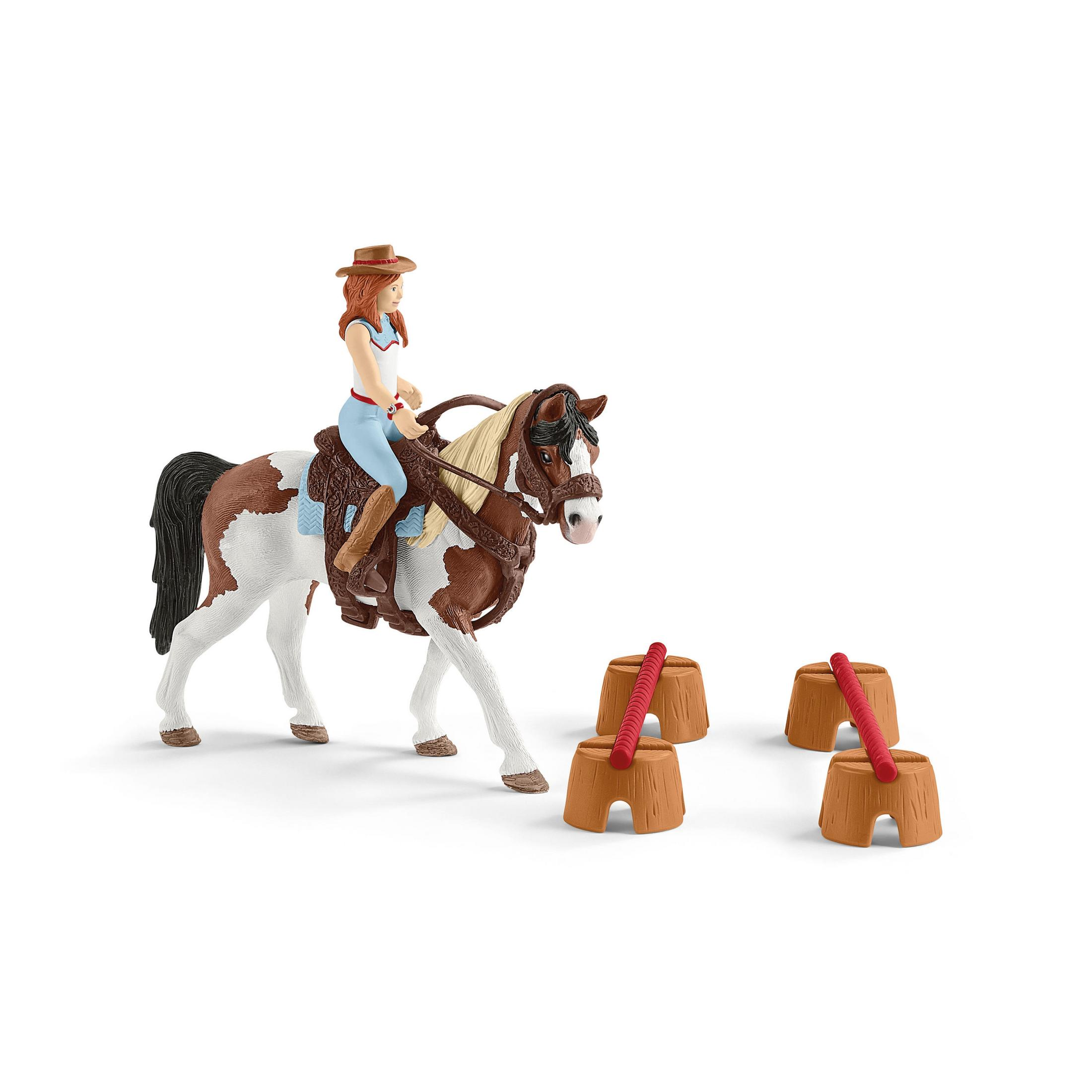Spielzeugpferd und -reiter mit Fässern. Das Pferd ist braun und weiß, und der Reiter hat einen Hut.