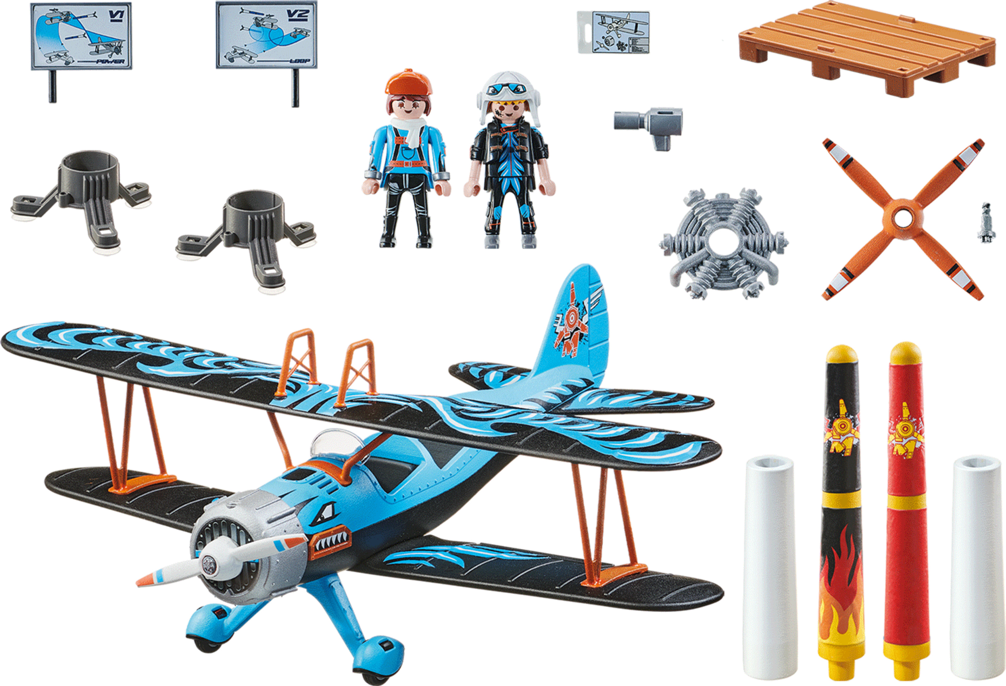 Avión de juguete con accesorios: figuras, letreros, piezas de motor, hélices y una paleta de madera sobre blanco.