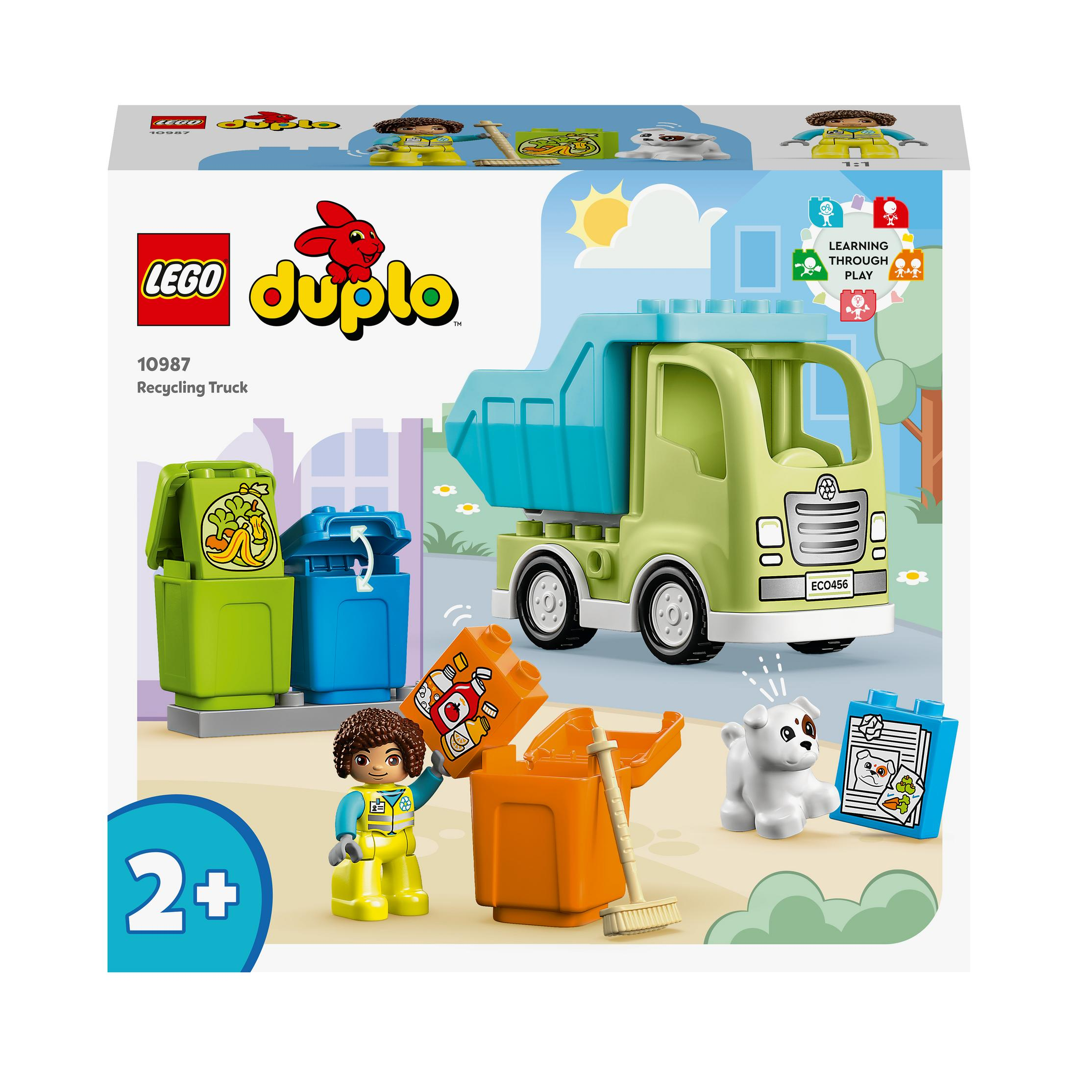 LEGO Duplo Recycling-Truck. Ein Mädchen und ein Hund sind in der Nähe des Trucks und der Mülltonnen.