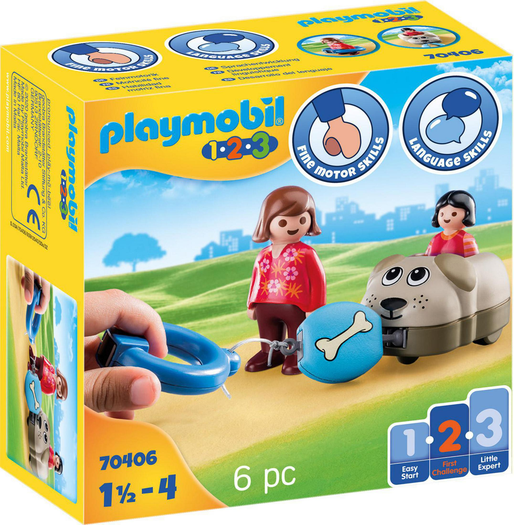 Playmobil-Box mit Figuren von Kindern und einem Hund. Die Box hat das Playmobil-Logo.