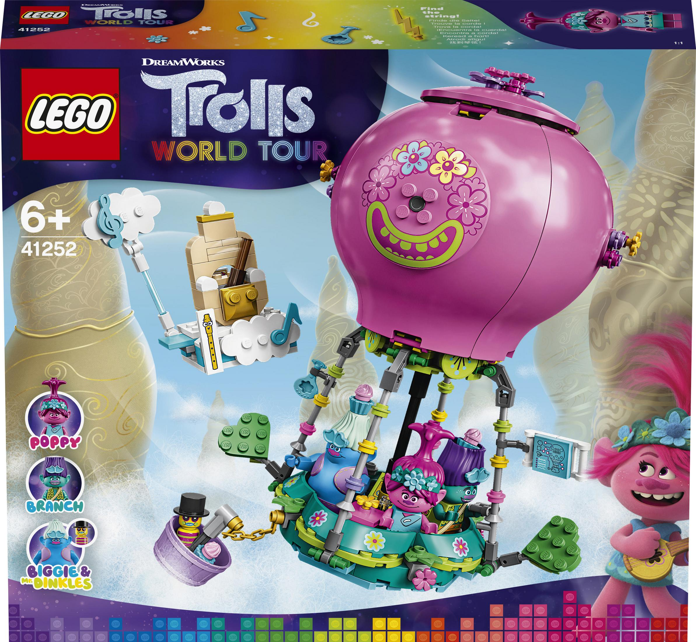 Lego Trolls World Tour Set mit rosa Heißluftballon und Figuren. Bunter Hintergrund.