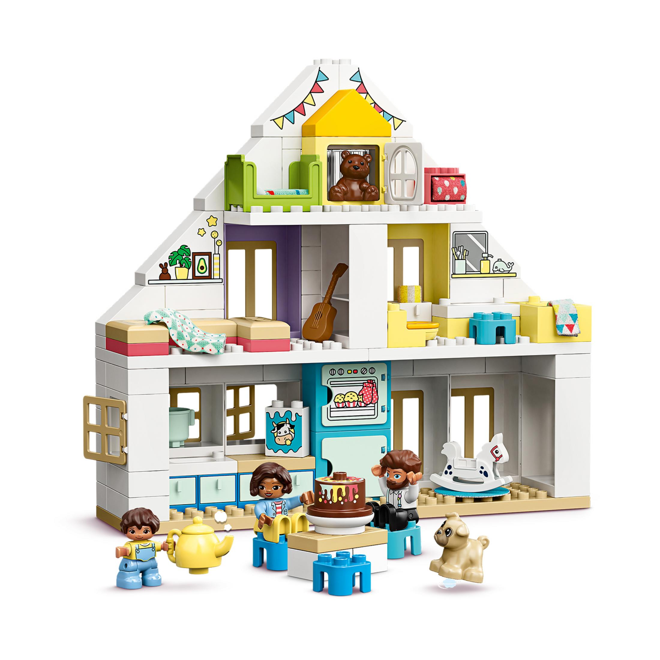Ensemble maison de poupée Lego Duplo : une maison à deux étages avec des figurines de famille, et des articles.