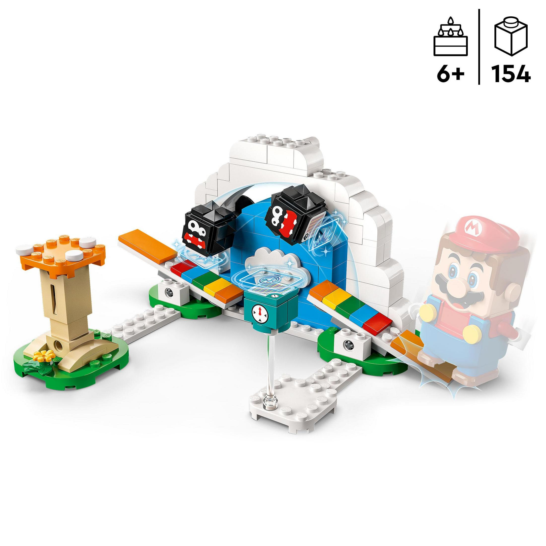 Lego set with Mario figure, dice, and various building structures on a white surface.