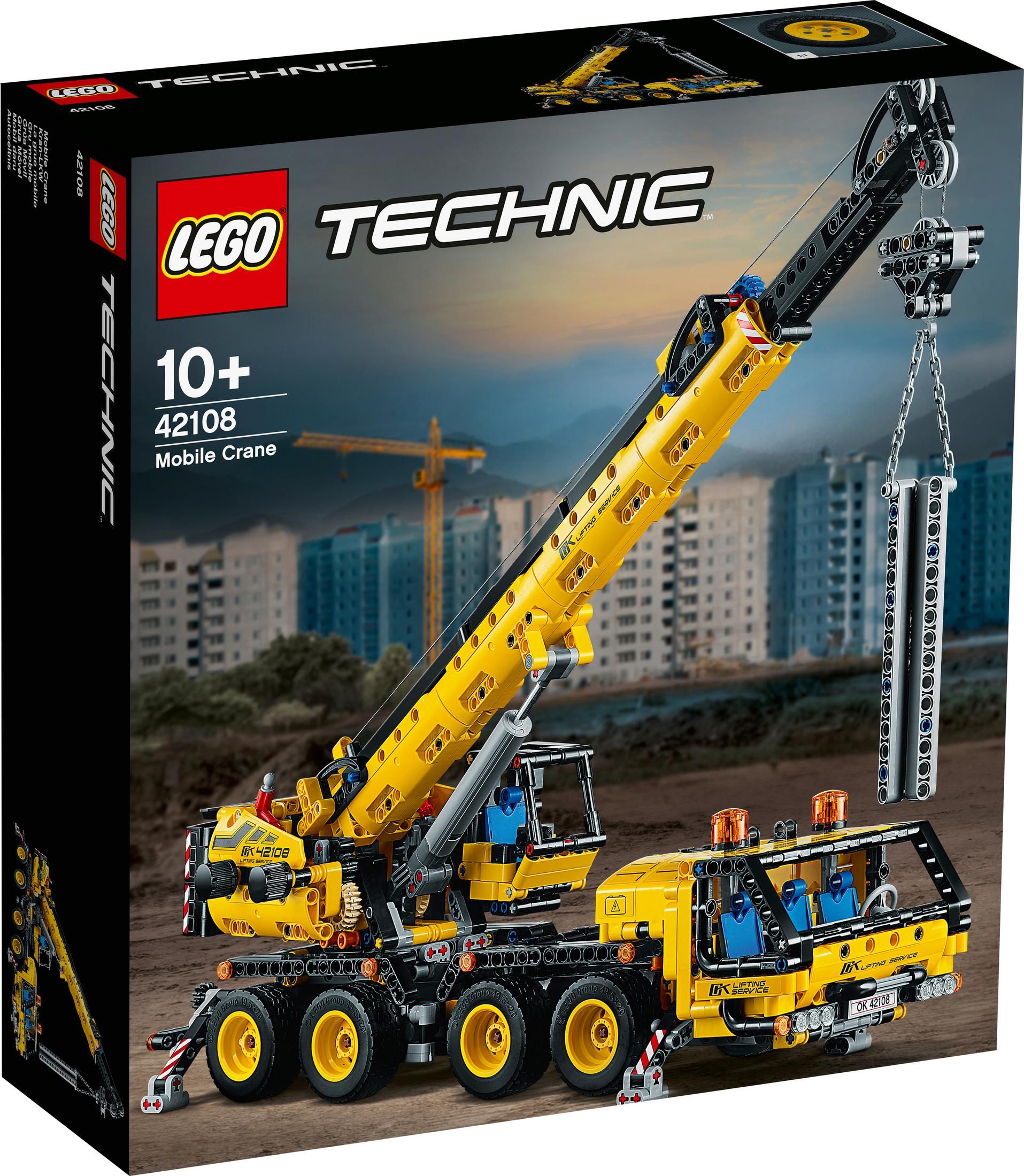 Yellow Lego Technic mobile crane box with a crane model on a construction site.