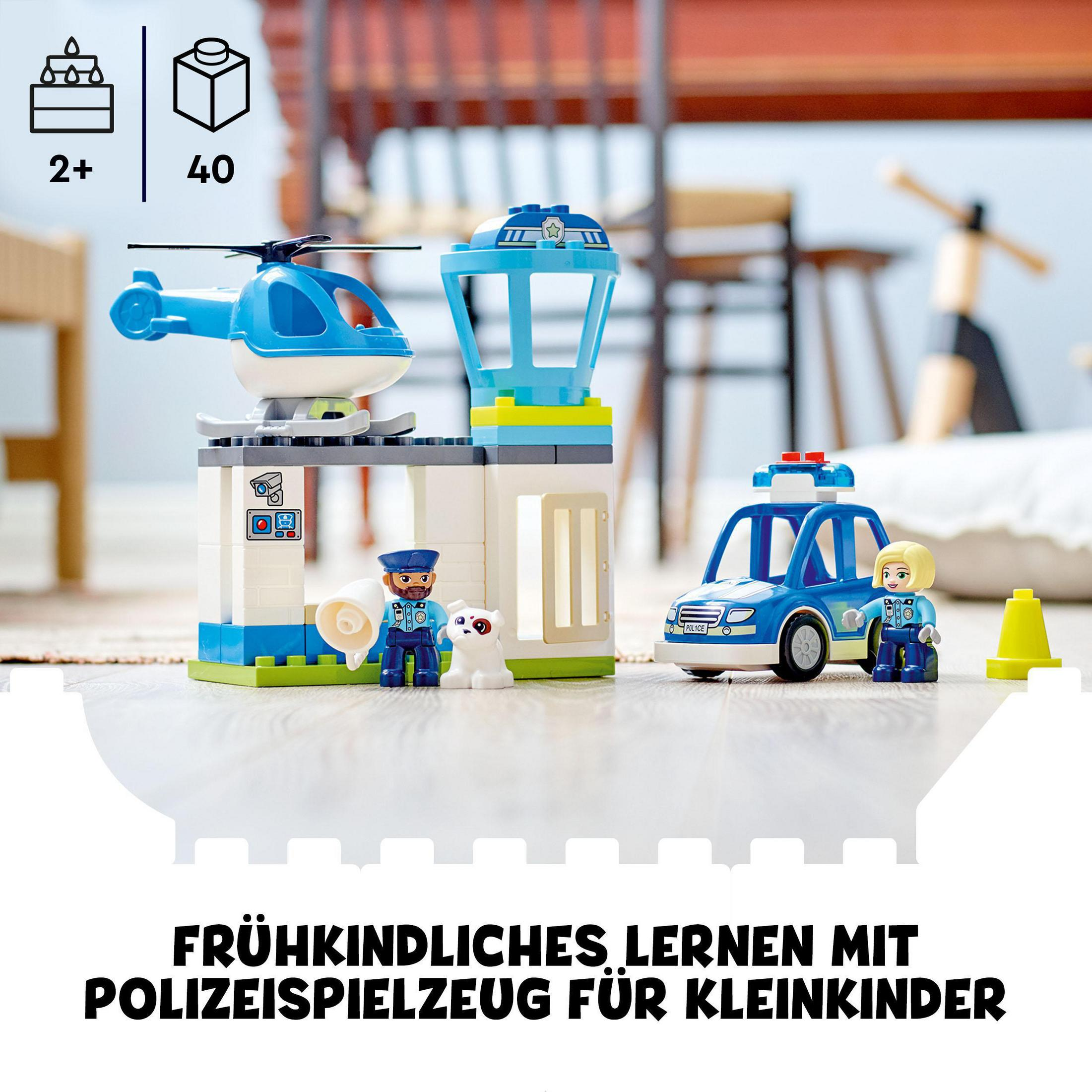 Un set de policía Lego con coche de policía, helicóptero y figuras. Incluye edificio y perro.