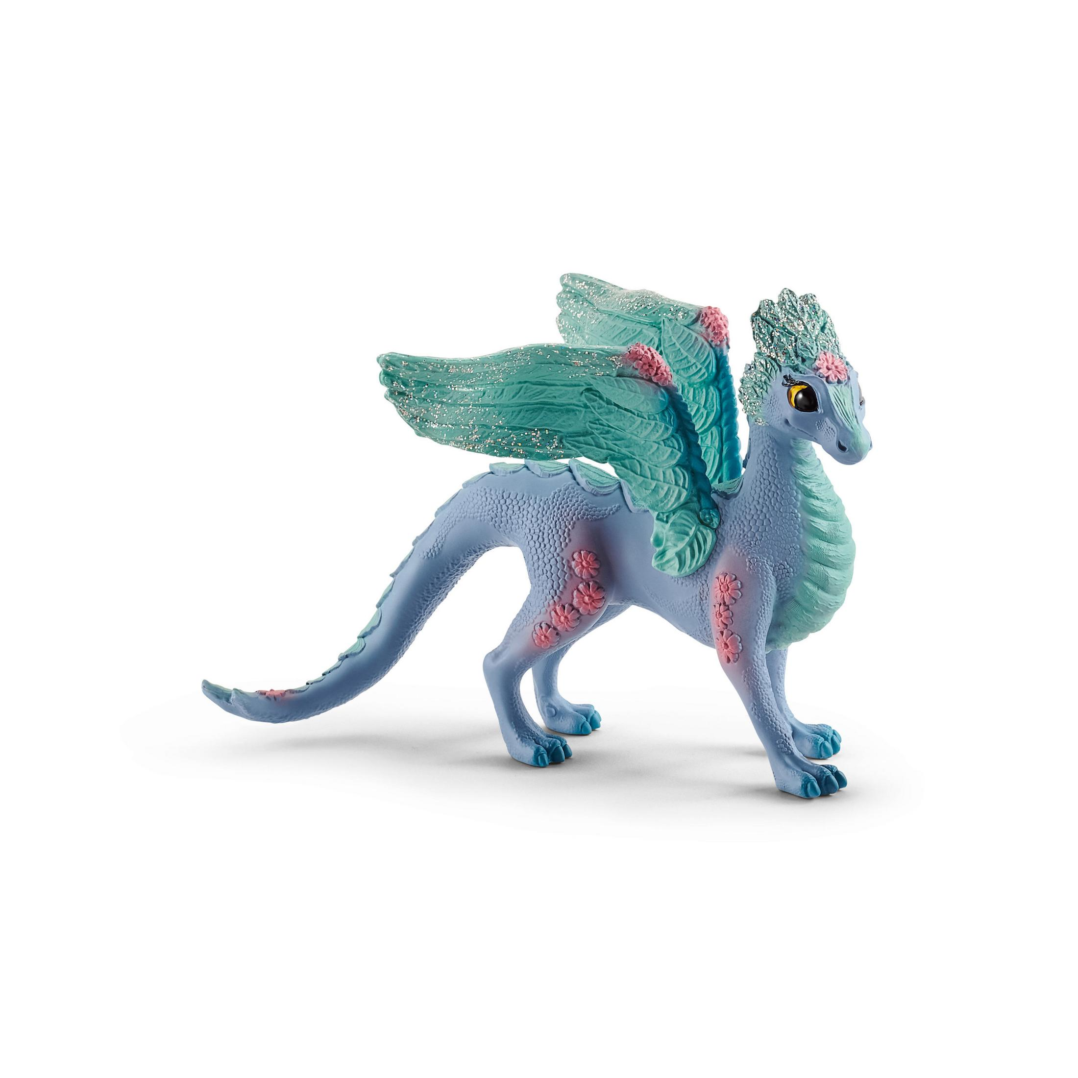 Ein blauer Spielzeugdrache mit rosa Blumen auf seinem Körper und seinen Flügeln.