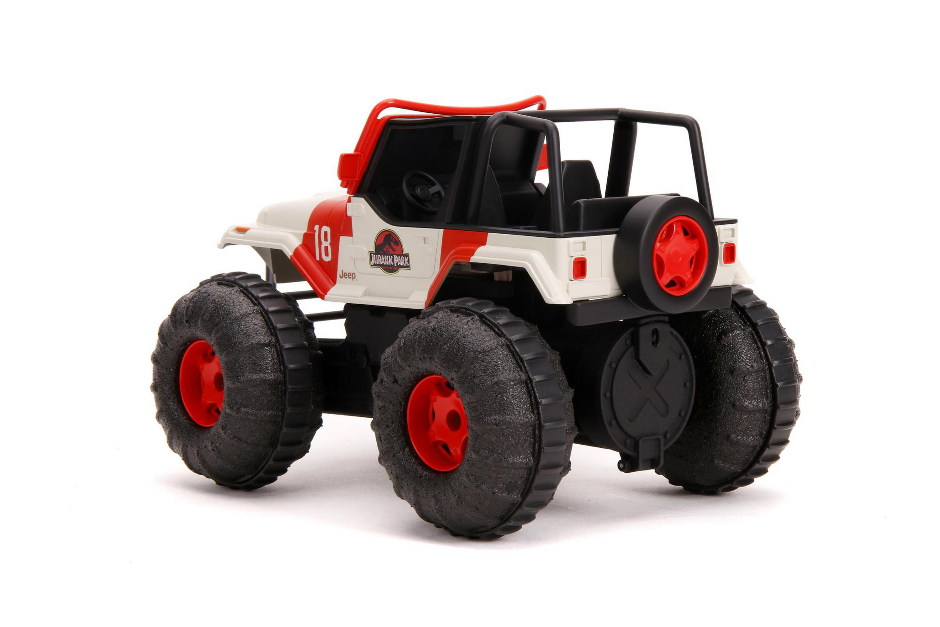 Seitenansicht des Spielzeug-Jeeps. Weißer Körper, rote Akzente. Schwarze Reifen, rote Radkappen.