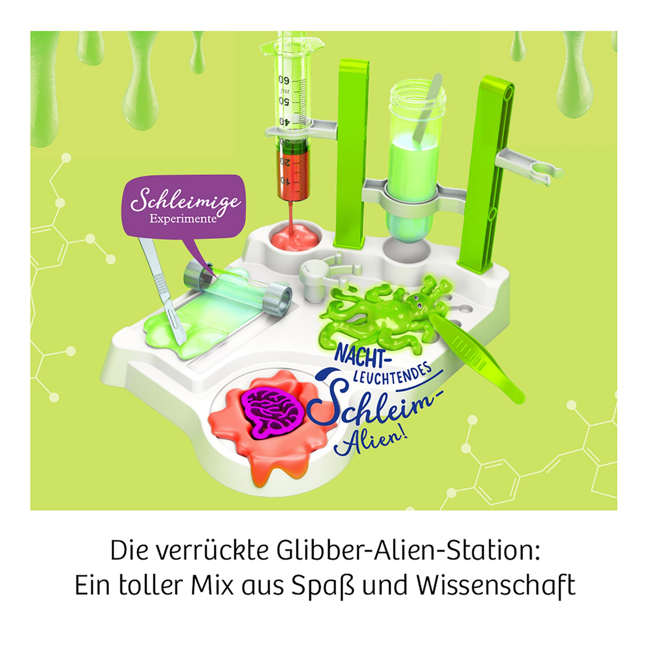 Ein wissenschaftliches Experimentier-Set mit Tisch, Reagenzgläsern und grünem Schleim mit der Aufschrift 'Nacht-Leuchtendes Schleim-Alien!'
