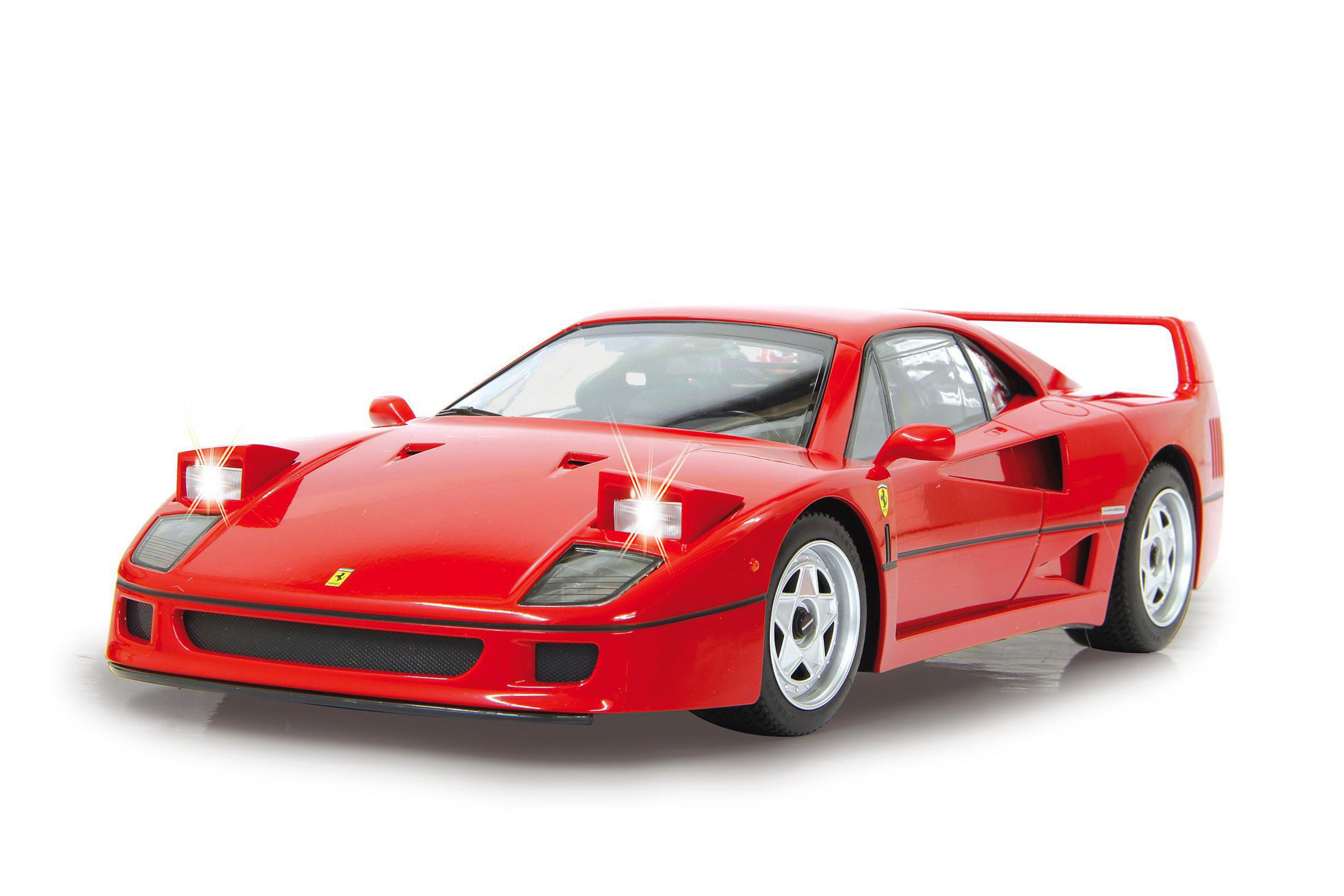 Ein roter Spielzeug-Ferrari F40 mit Lichtern auf weißem Hintergrund.