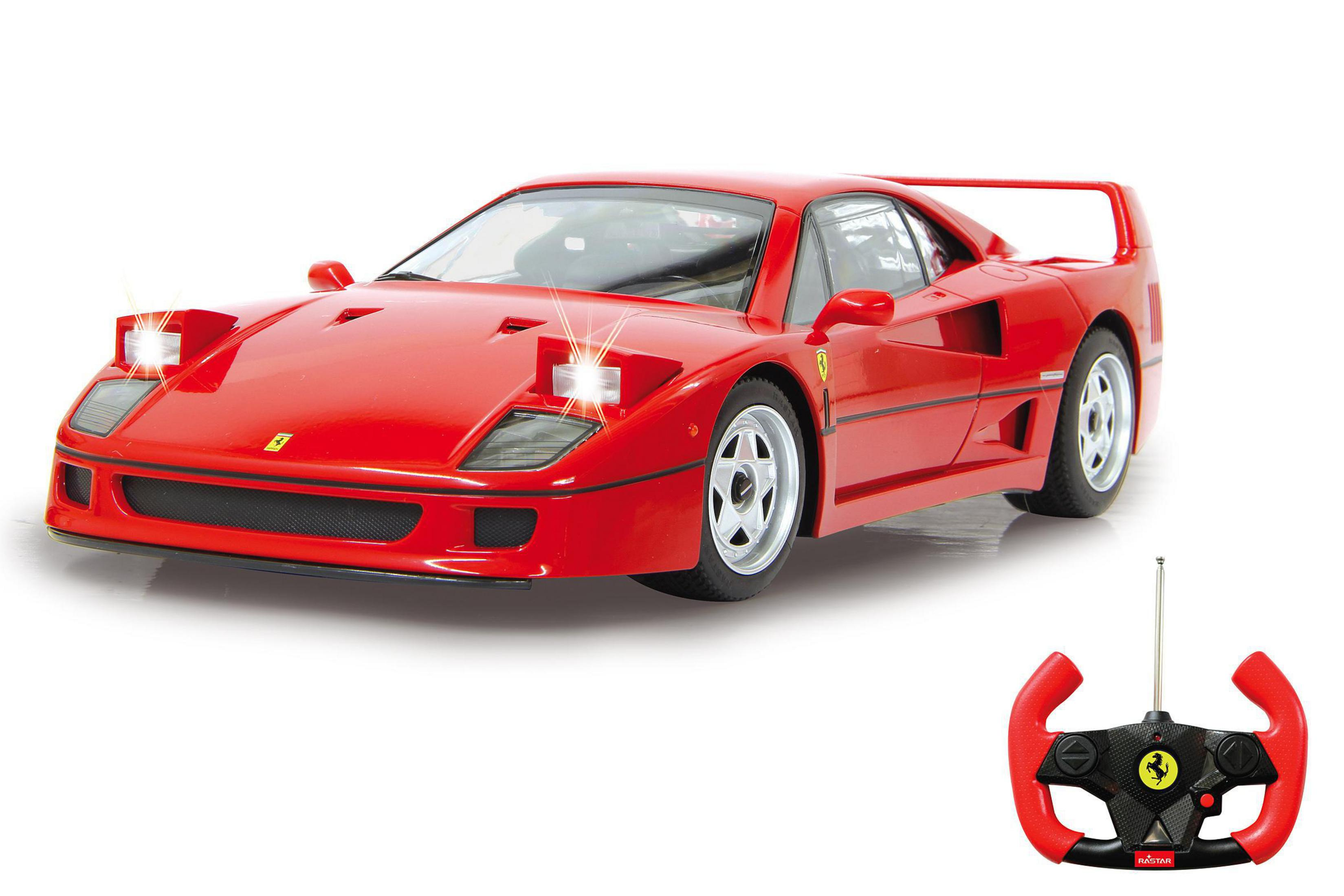 Roter Spielzeug-Ferrari F40 mit eingeschalteten Scheinwerfern und Fernbedienung.