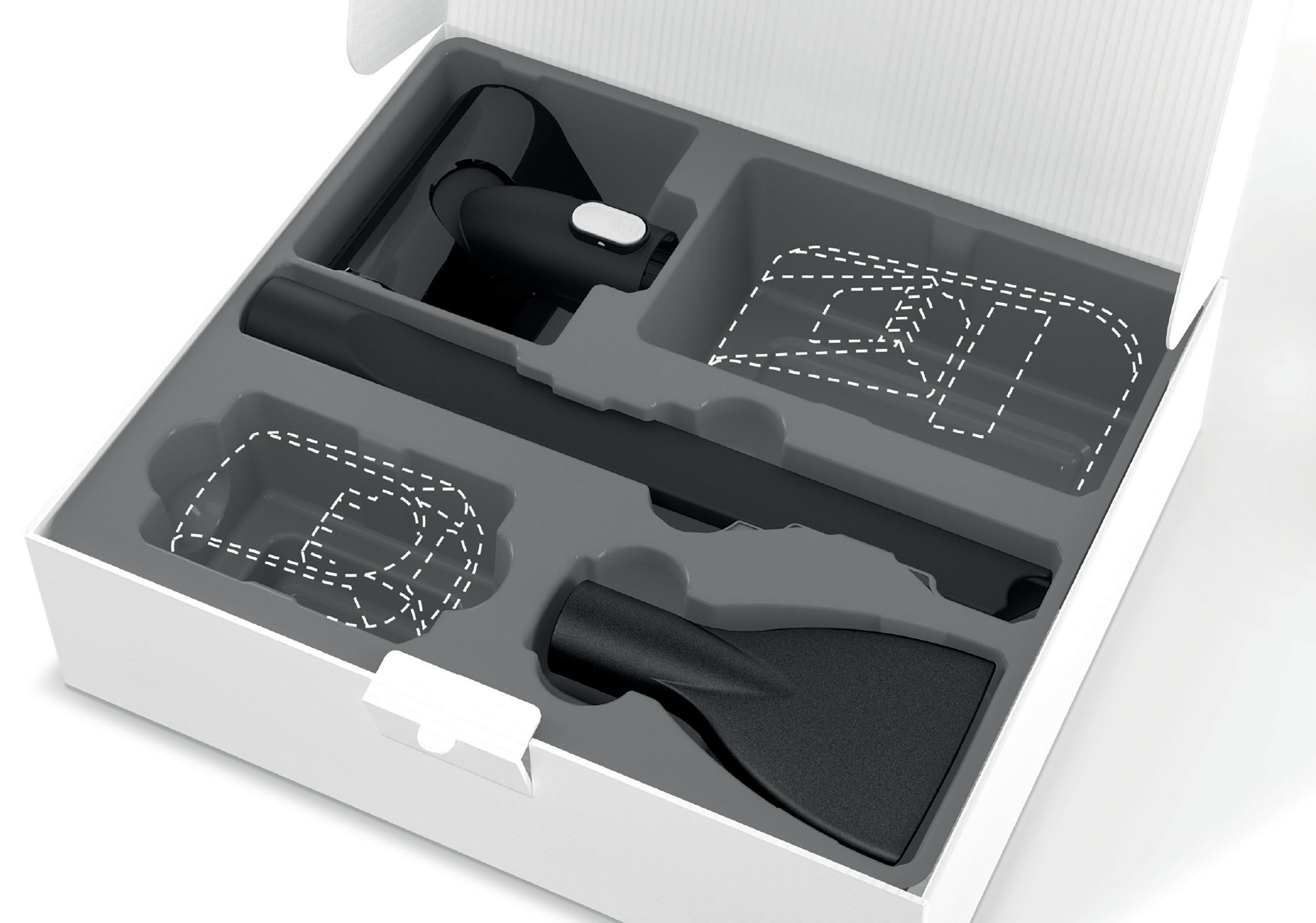 Caja blanca abierta con accesorios para aspiradora. Varios accesorios negros están en la caja.