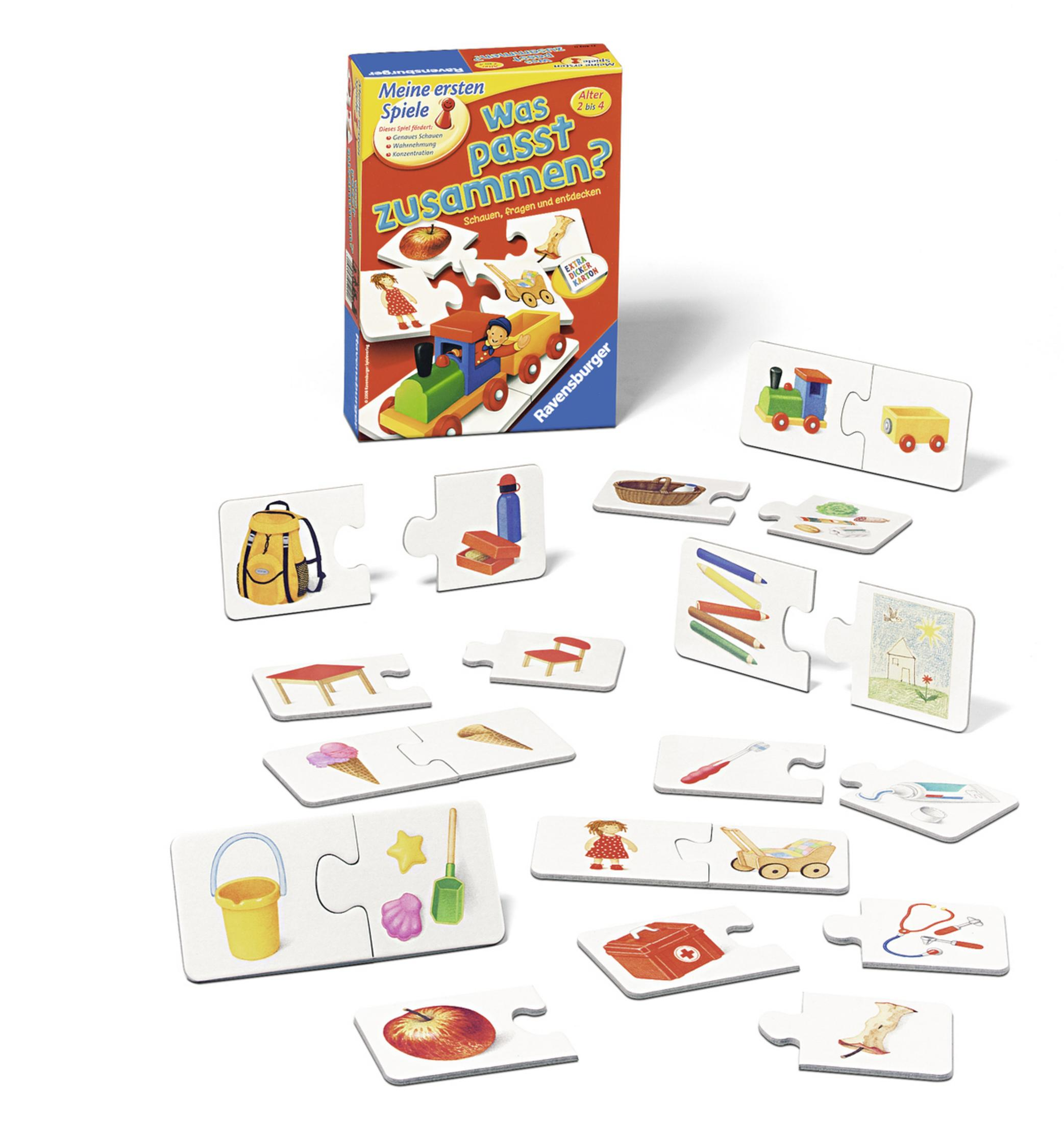 Ein Kinderspiel mit Puzzleteilen, die um eine Schachtel herum verstreut sind.