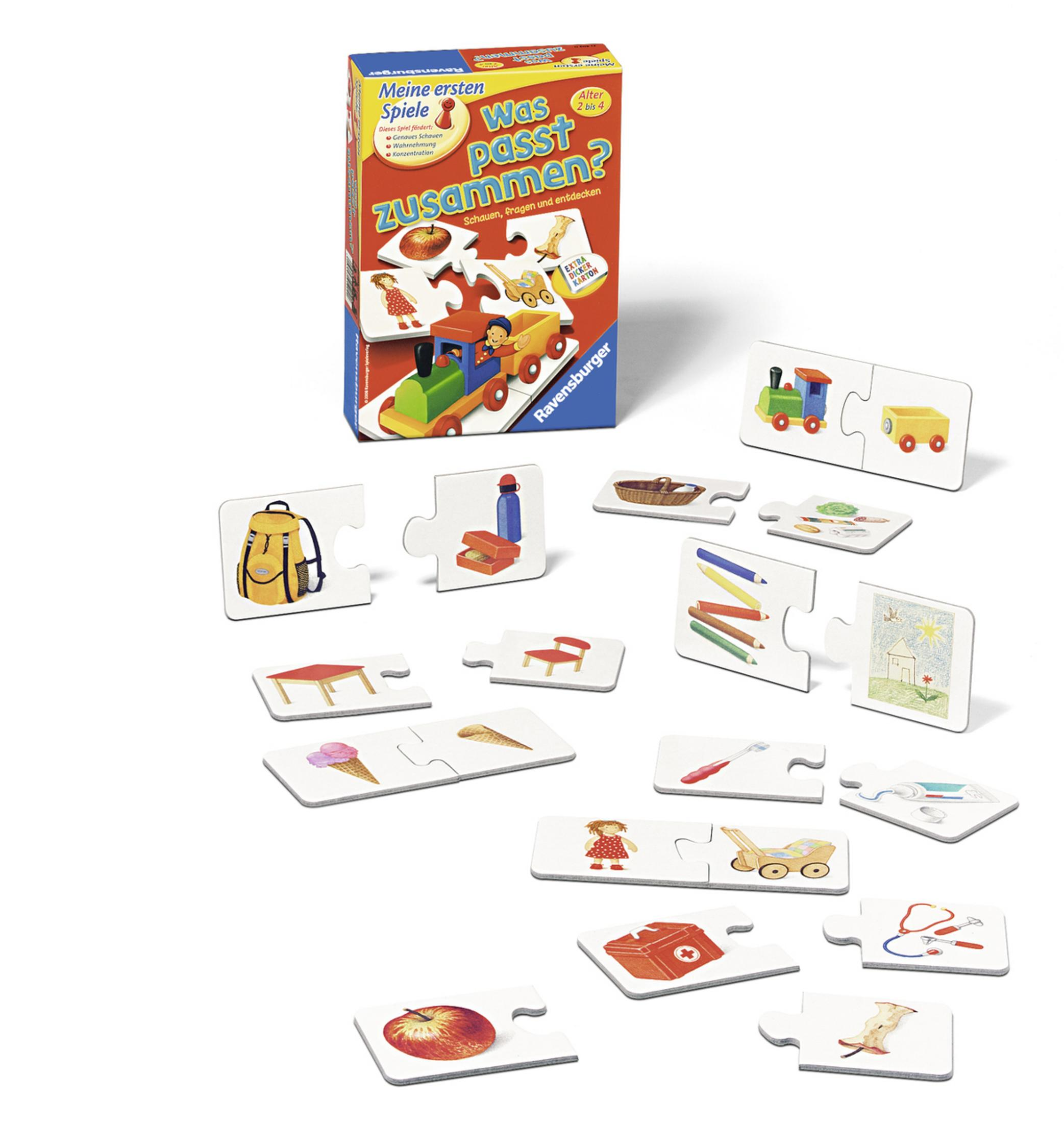 Ein Kinderspiel mit Puzzleteilen, die um eine Schachtel herum verstreut sind.