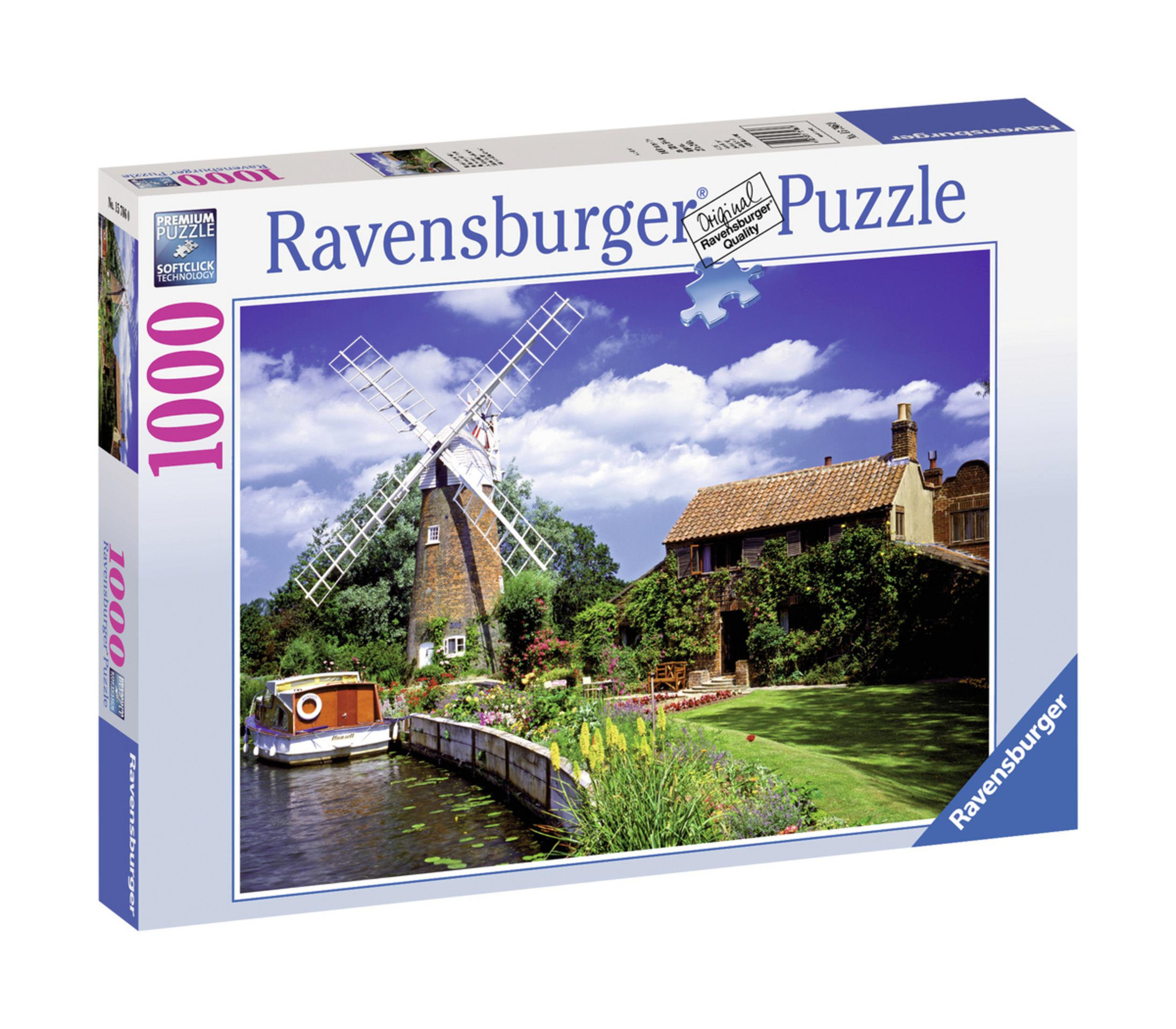 Ravensburger Puzzledose mit Windmühle, Haus, Fluss mit Boot und Garten unter blauem Himmel.