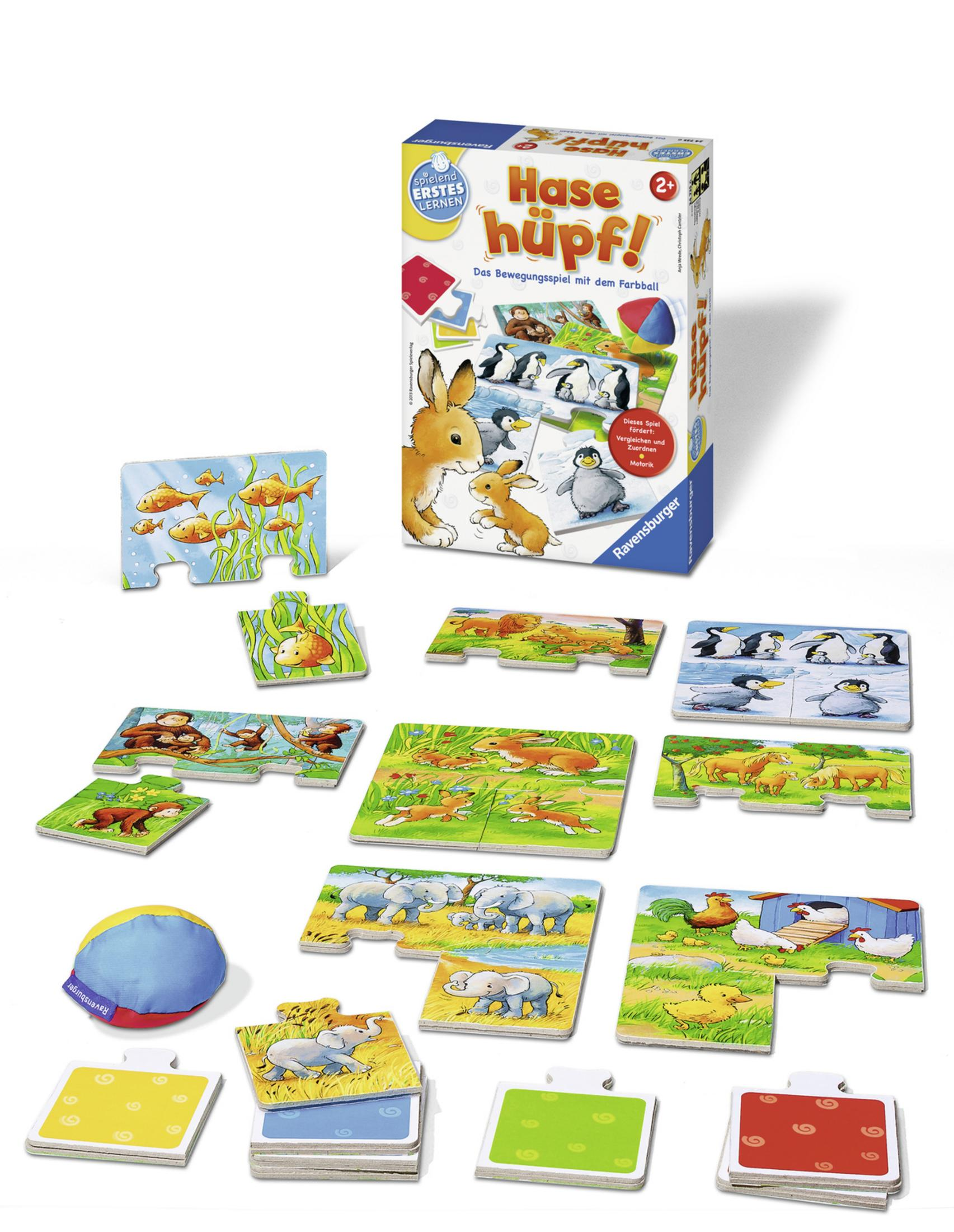 Eine Puzzlespielbox mit verstreuten Puzzleteilen.