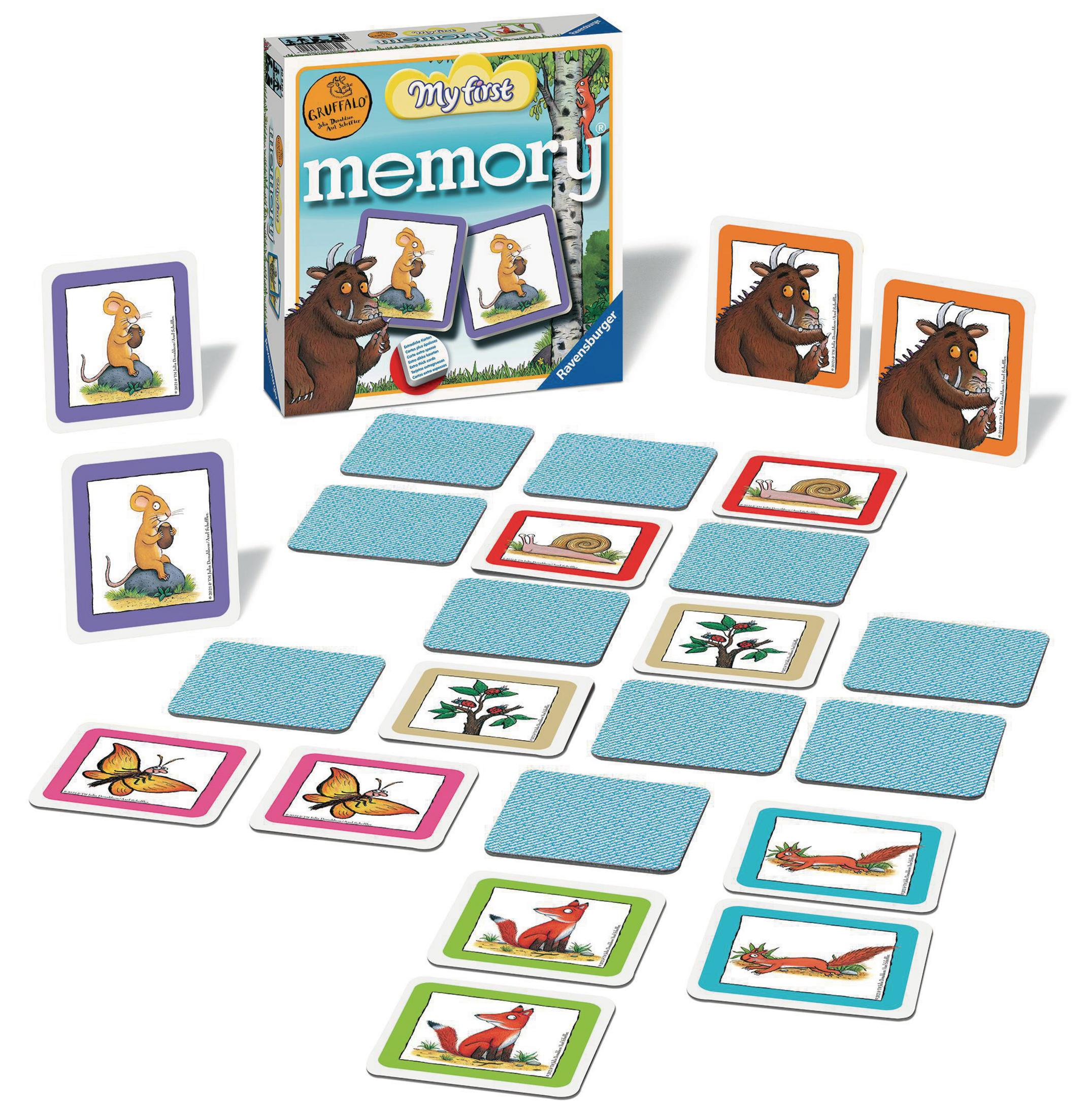 Ein Brettspiel mit Karten mit Gruffalo-Figuren, mit einer Schachtel und verstreuten Karten.