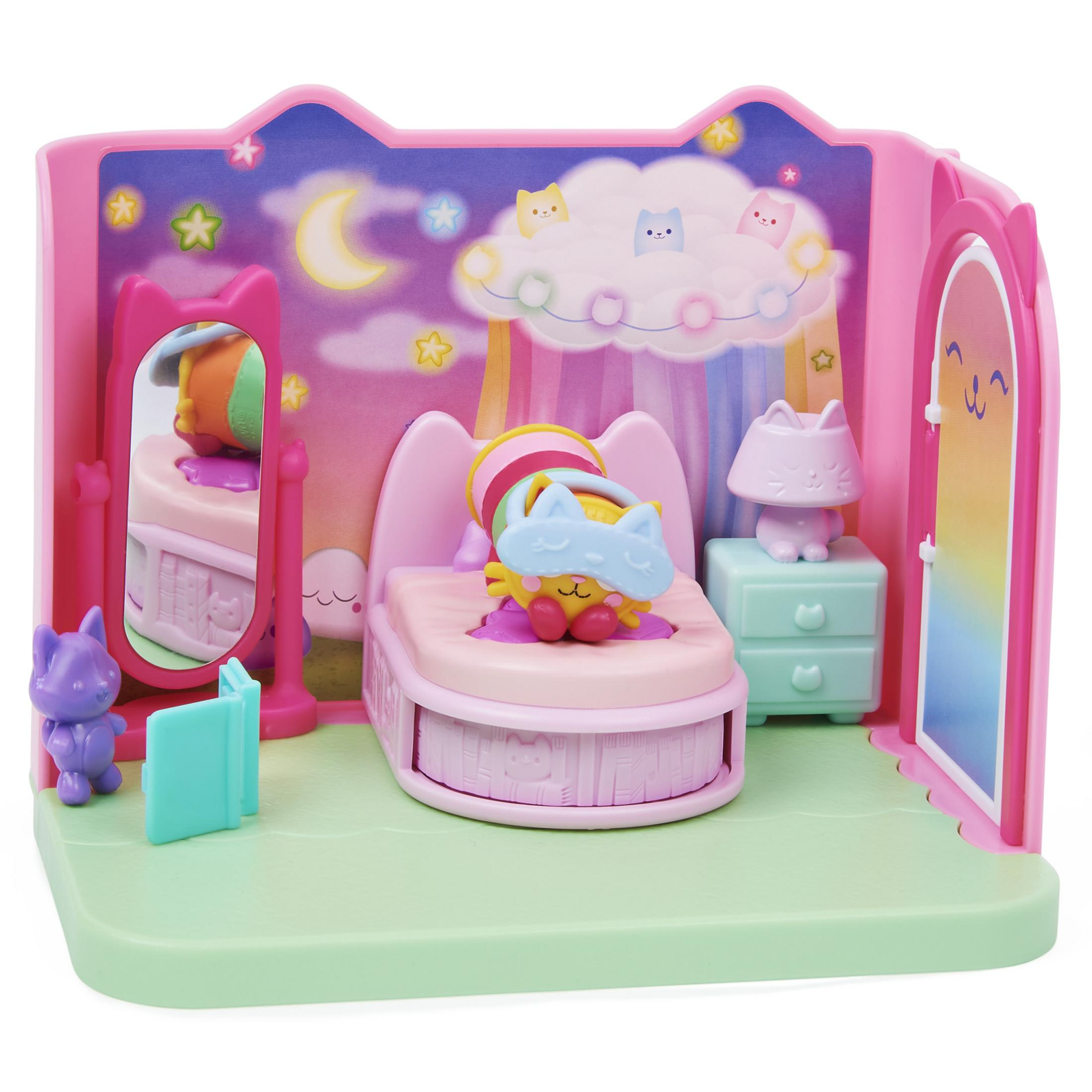 Un set da camera da letto per gatti rosa con letto, specchio e piccole figure di gatti.