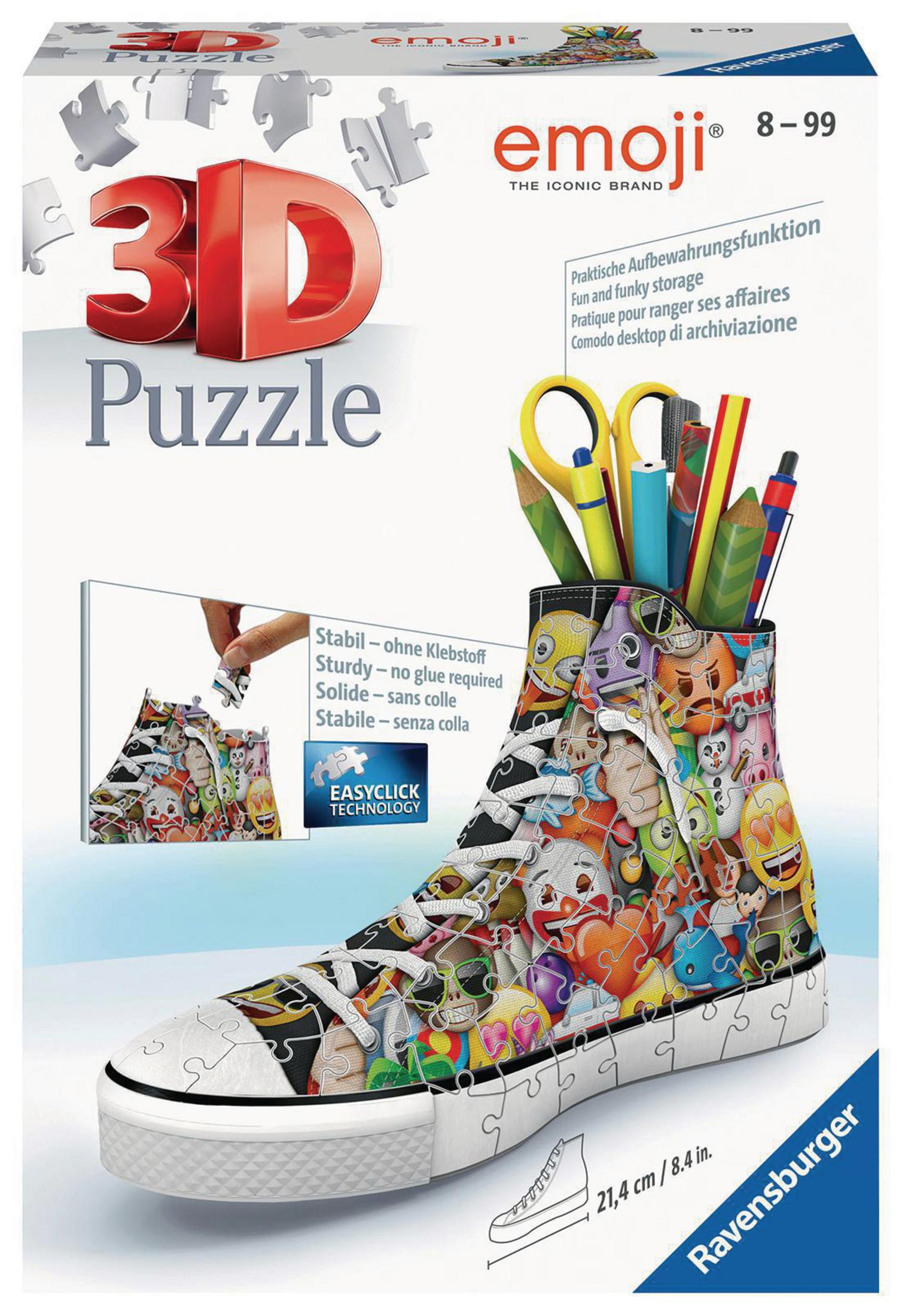 Pudełko z puzzlami 3D. Pokazuje układankę w kształcie buta wypełnioną emotikonami. Pudełko zawiera ołówki i nożyczki.