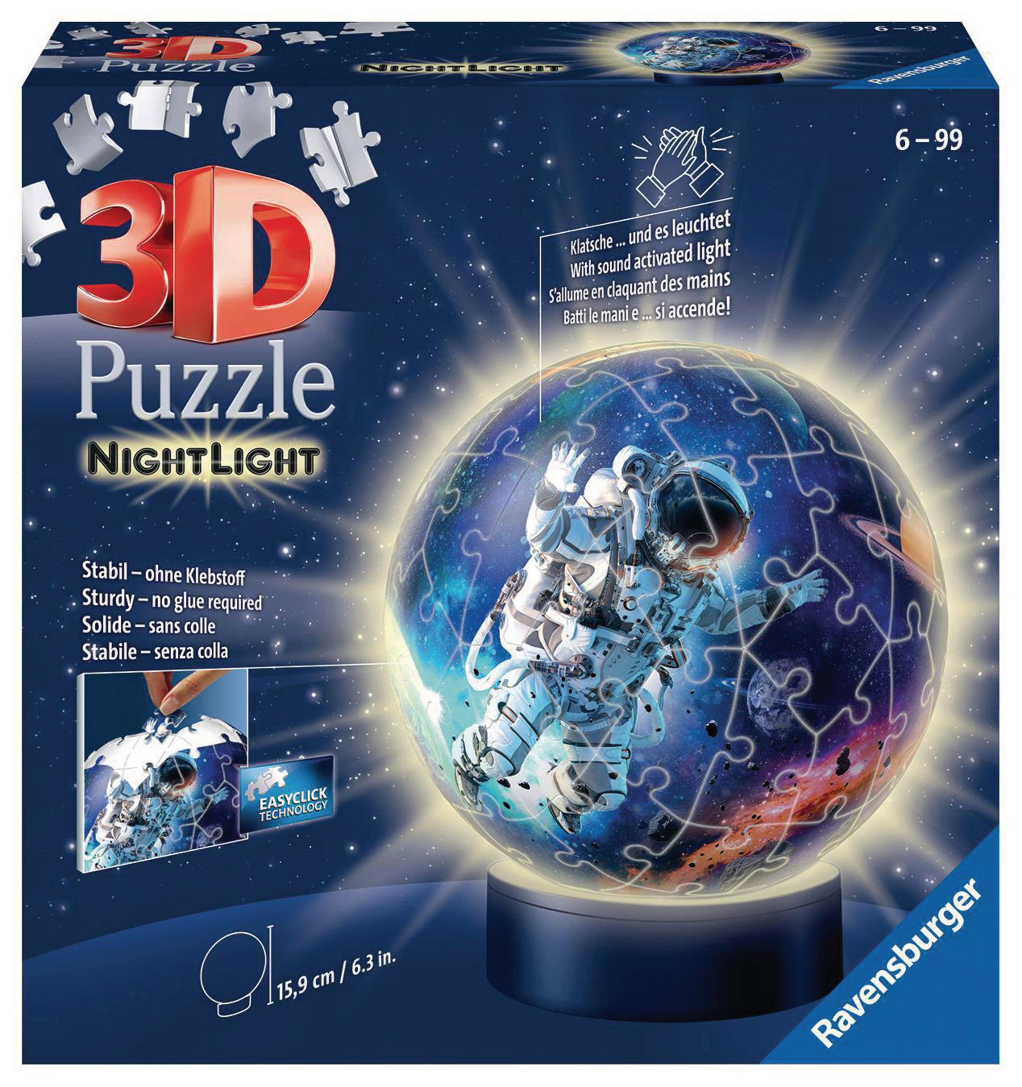 Puzzle 3D Nightlight, kula z astronautą w kosmosie i pudełko z puzzlami.