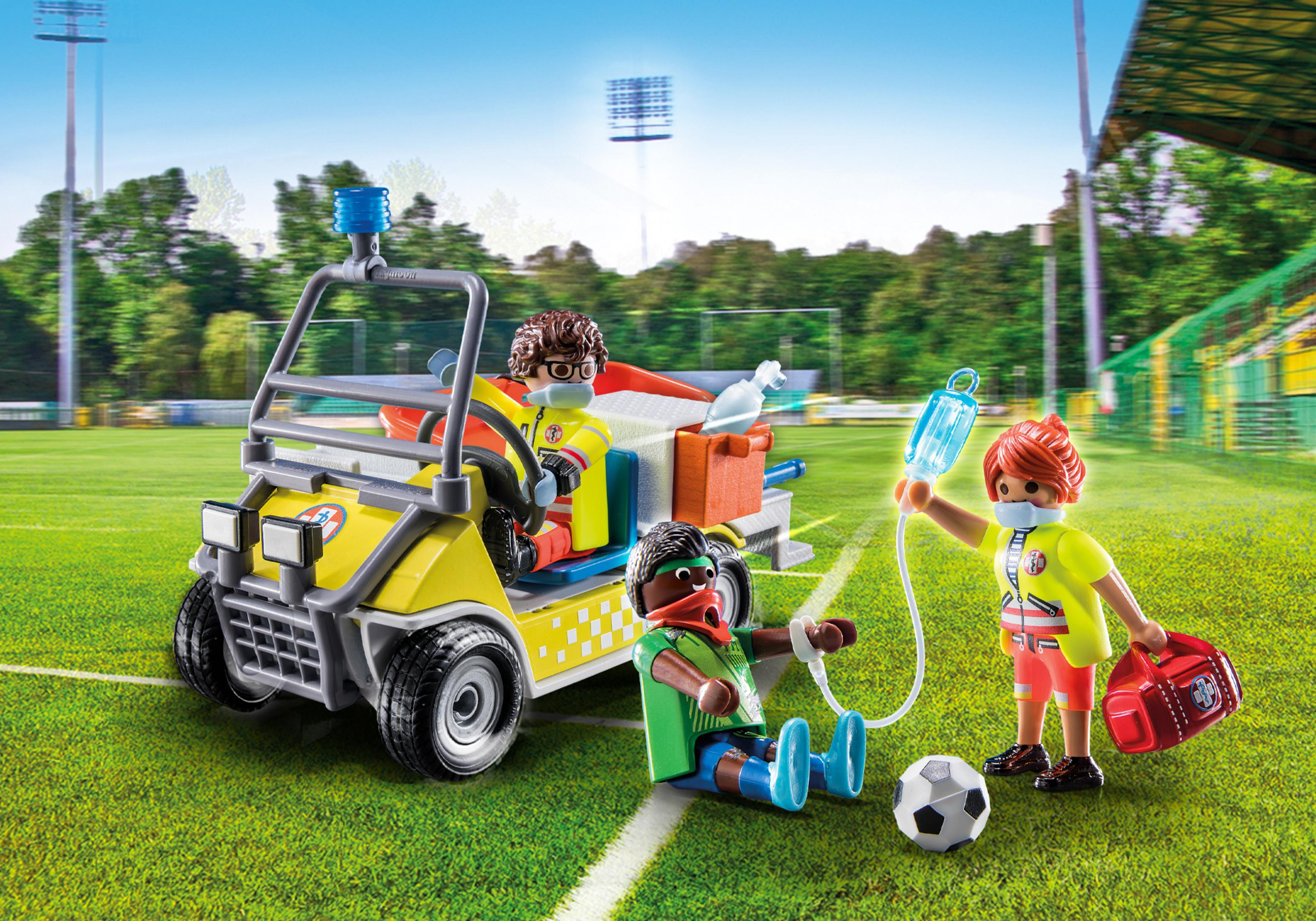 Playmobil-Set, das ein medizinisches Team auf einem Fußballfeld darstellt. Figuren umfassen verletzte Spieler und medizinisches Personal.