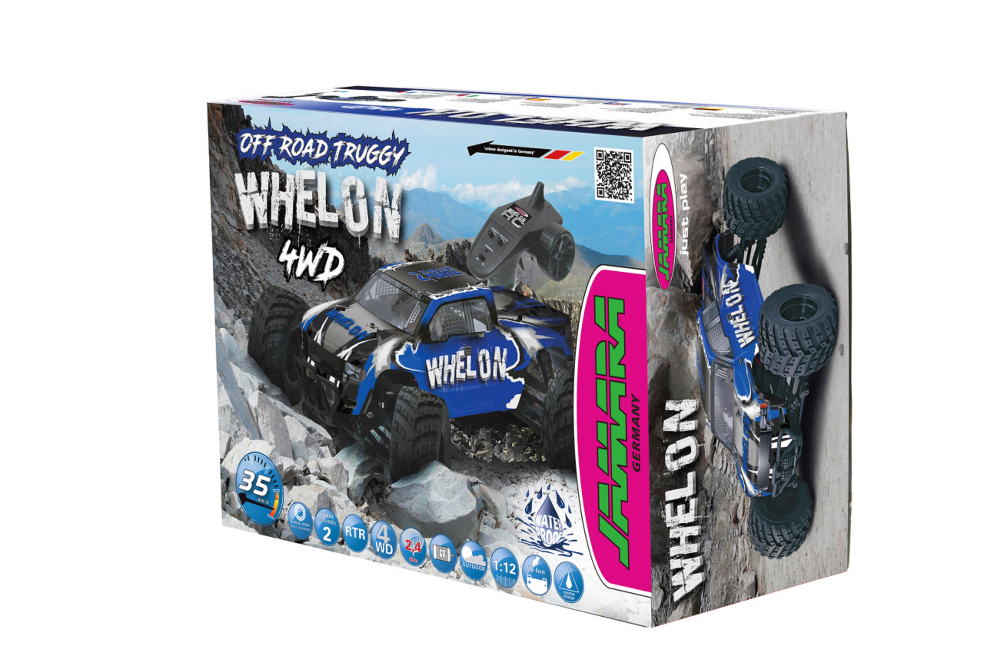 Ein Spielzeug-Geländewagen in einer Box, mit Fernbedienung und felsigem Hintergrund.