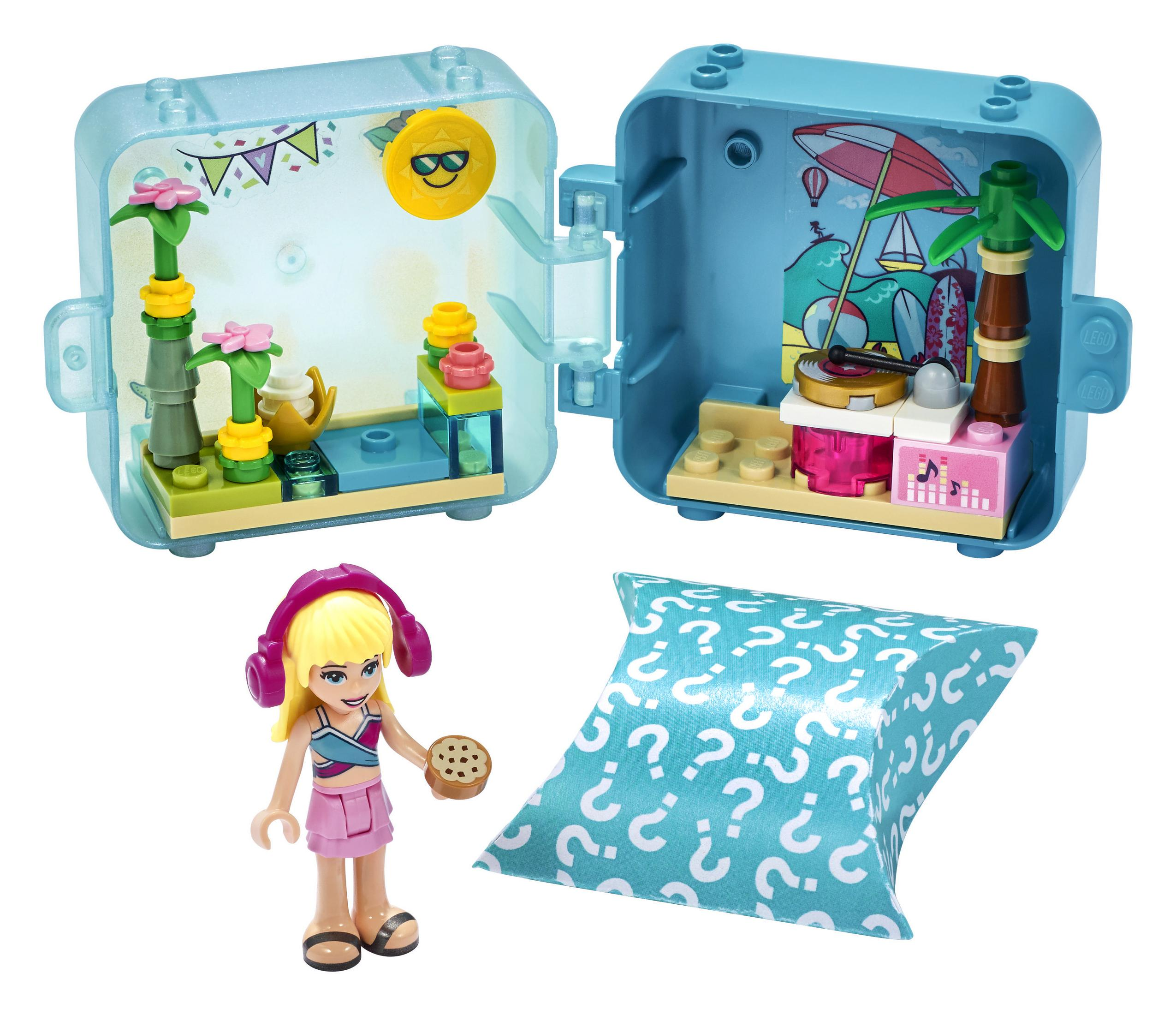 Zestaw LEGO Friends. Dwie otwarte walizki ze sceną na plaży, mini-figurką i tajemniczą torebką. Niebieski i żółty.