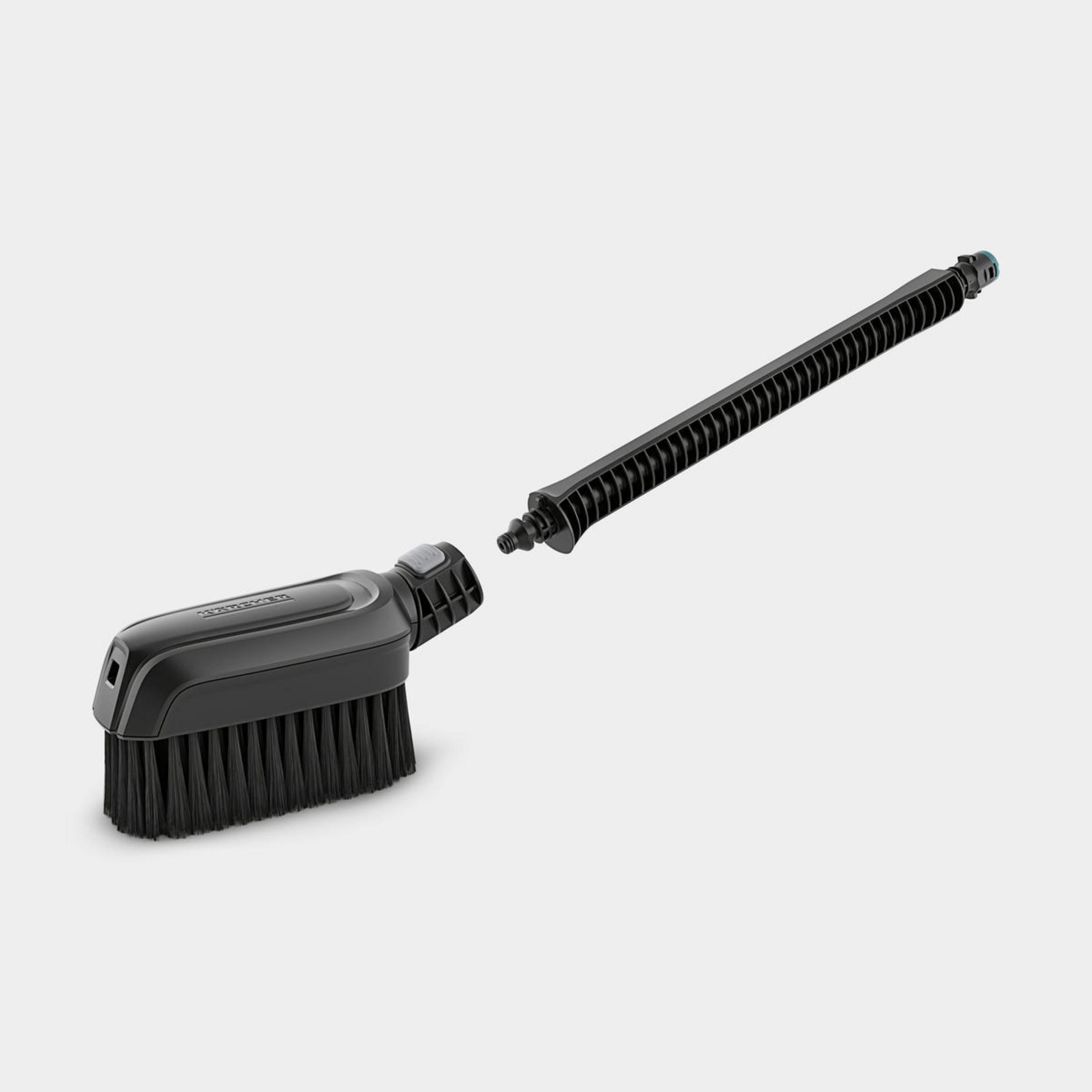 Spazzola per idropulitrice nera con prolunga nera, entrambe staccate.