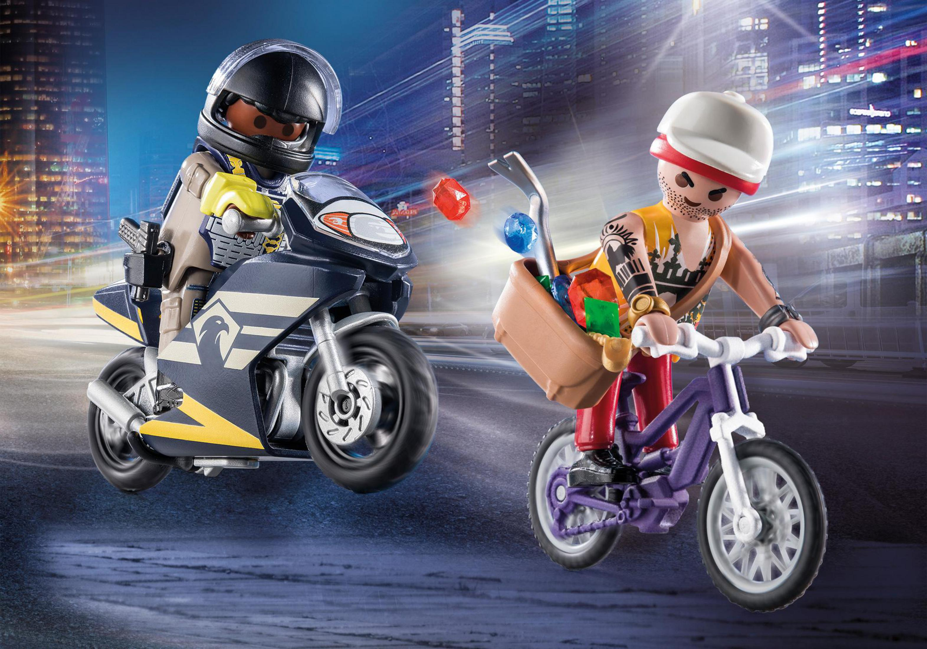 Playmobil-Figuren: ein Polizist auf einem Motorrad, der einen Dieb auf einem Fahrrad verfolgt.