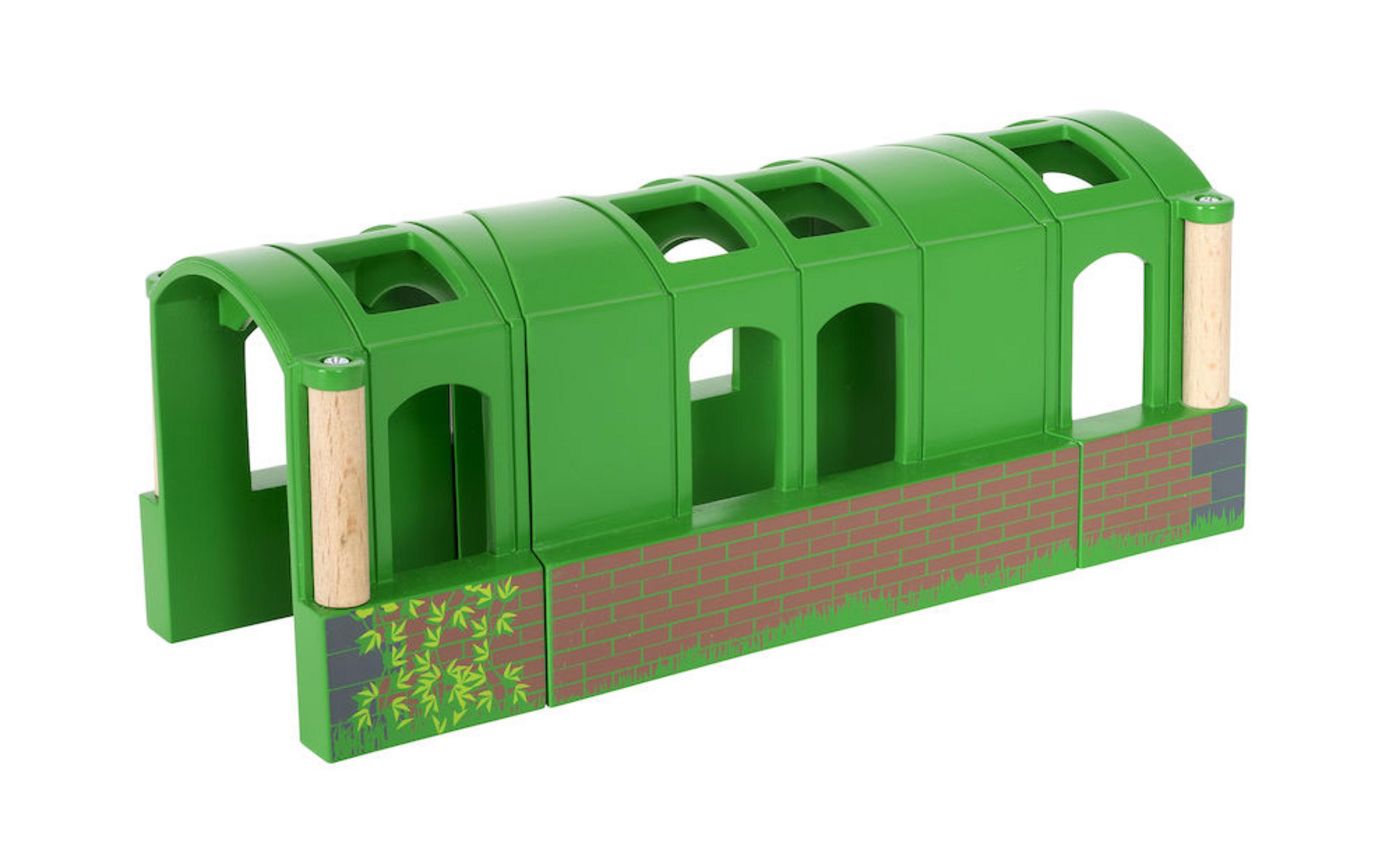 Grüner Spielzeug-Eisenbahntunnel aus Holz mit Backsteinmuster und Holzsäulen.