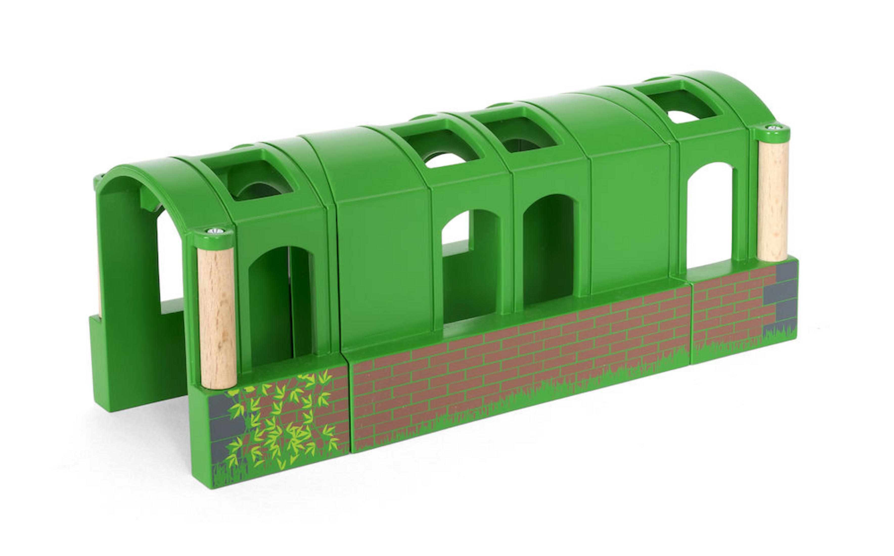Ein grüner Holzeisenbahntunnel mit Backsteinsockel und dekorativen Elementen.
