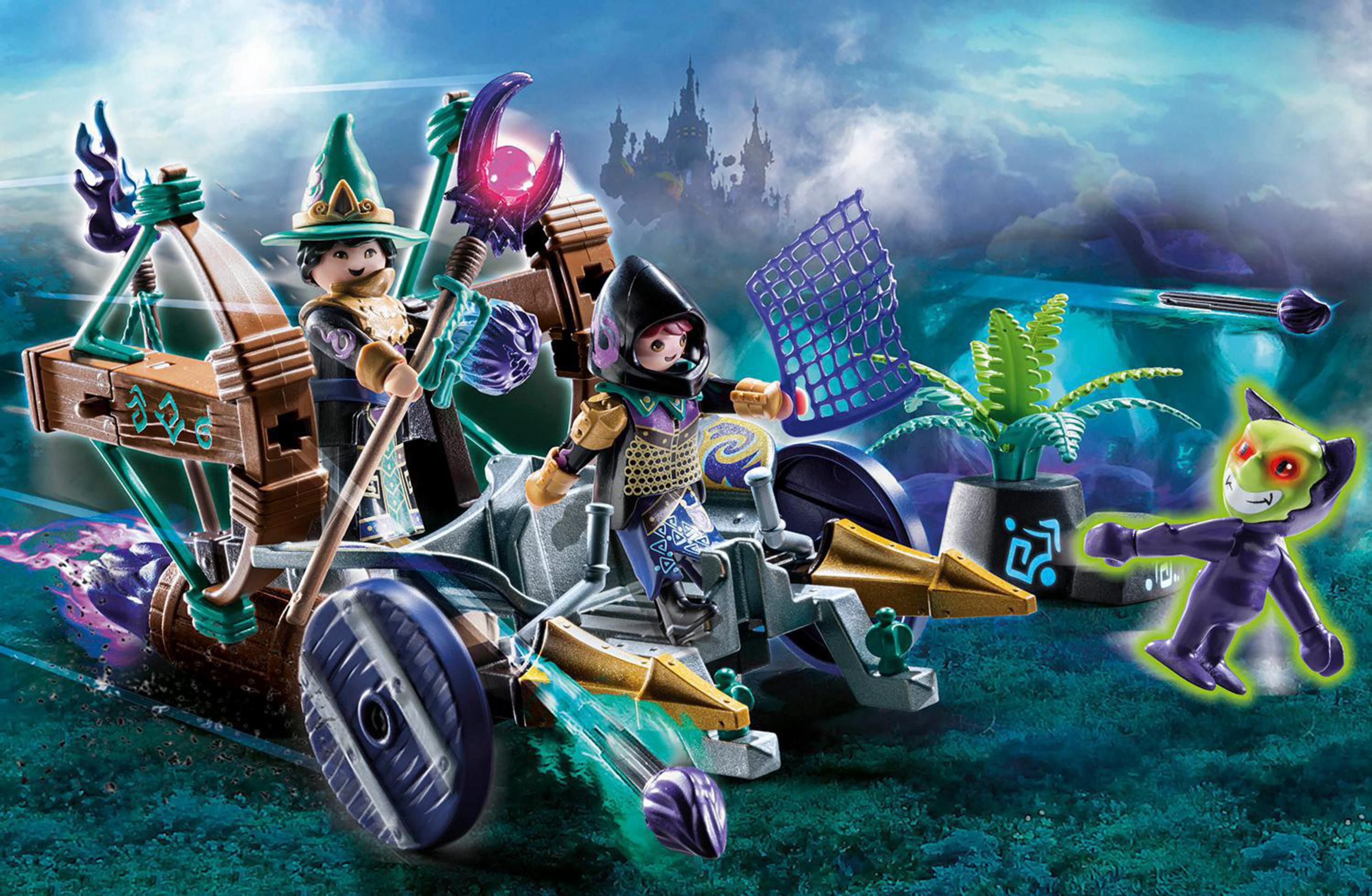 Playmobil-Szene mit Zauberer, Figuren in einem Streitwagen und einem Monster.