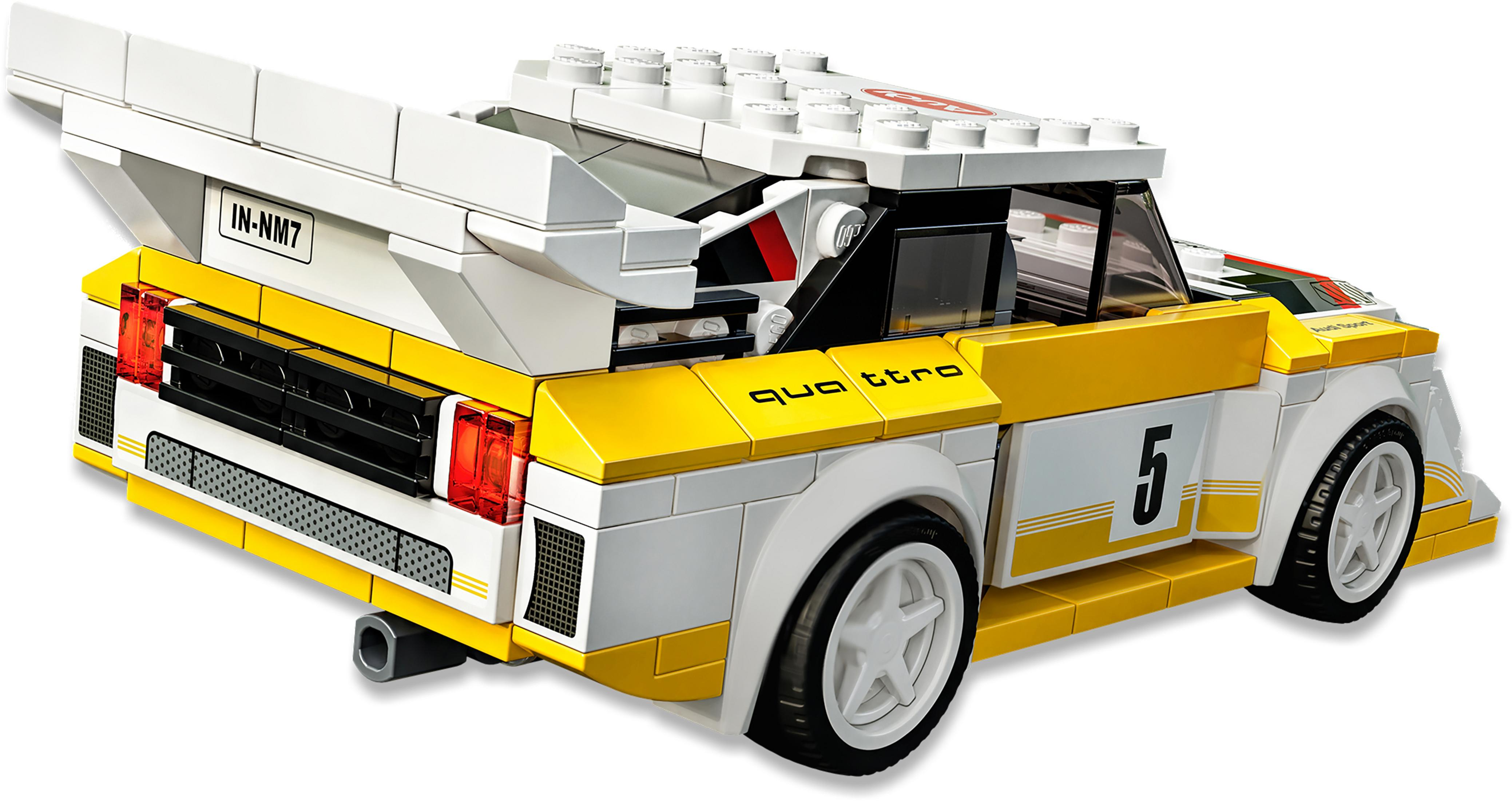 Lego Audi Quattro Automodell, hauptsächlich gelb und weiß, mit schwarzen und roten Akzenten und einem weißen Spoiler.